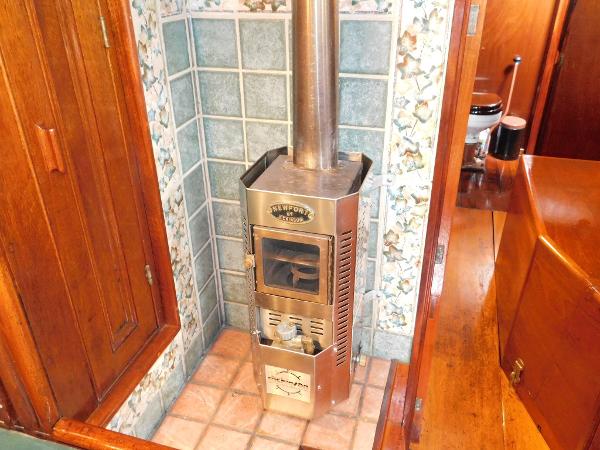 Vintage Newport stove in a 1983 Custom Murray Peterson Coaster III boat interior.