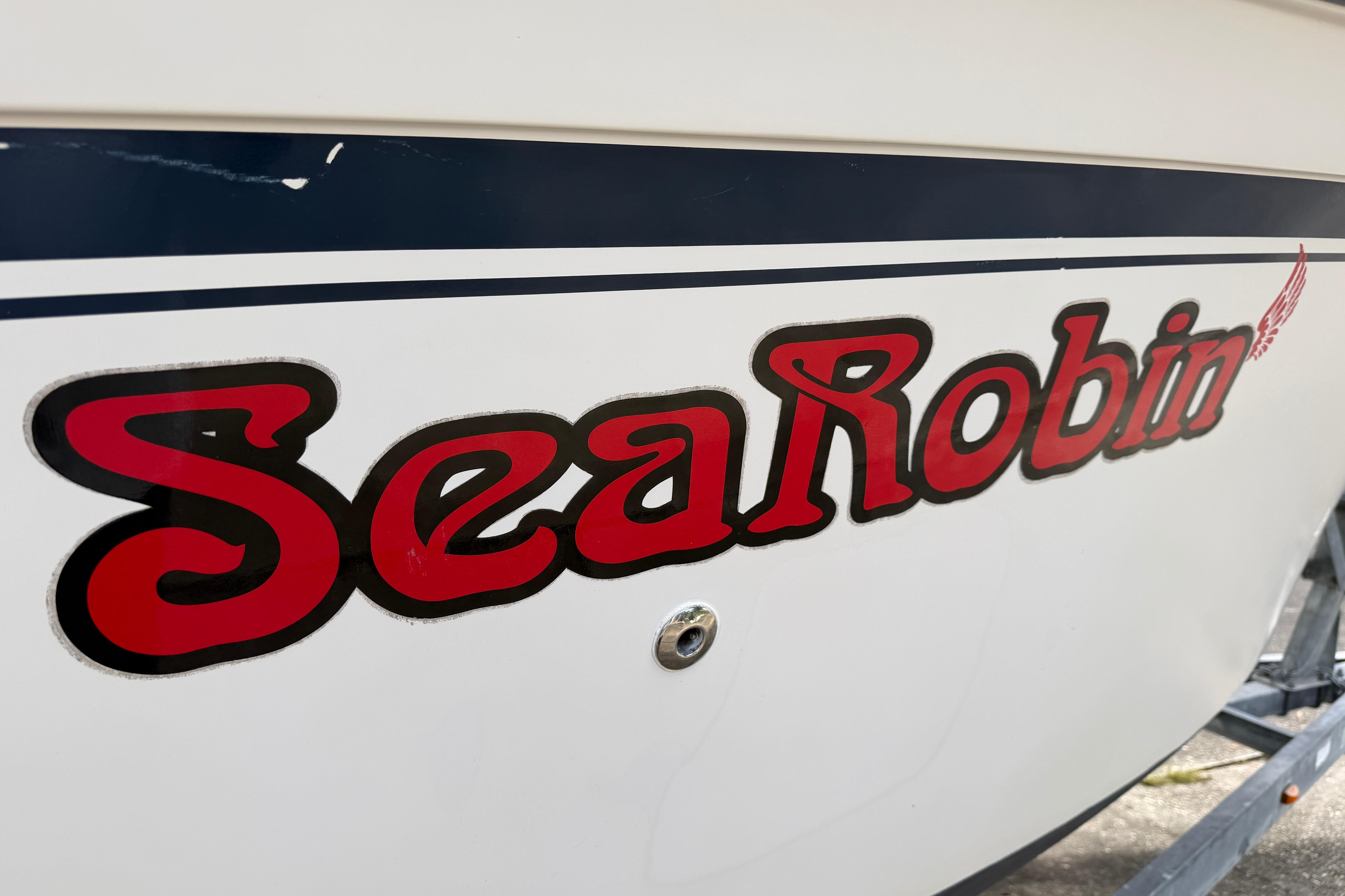 1987 Grady-White Seafarer 226 boat with "Sea Robin" decal in bold red letters.