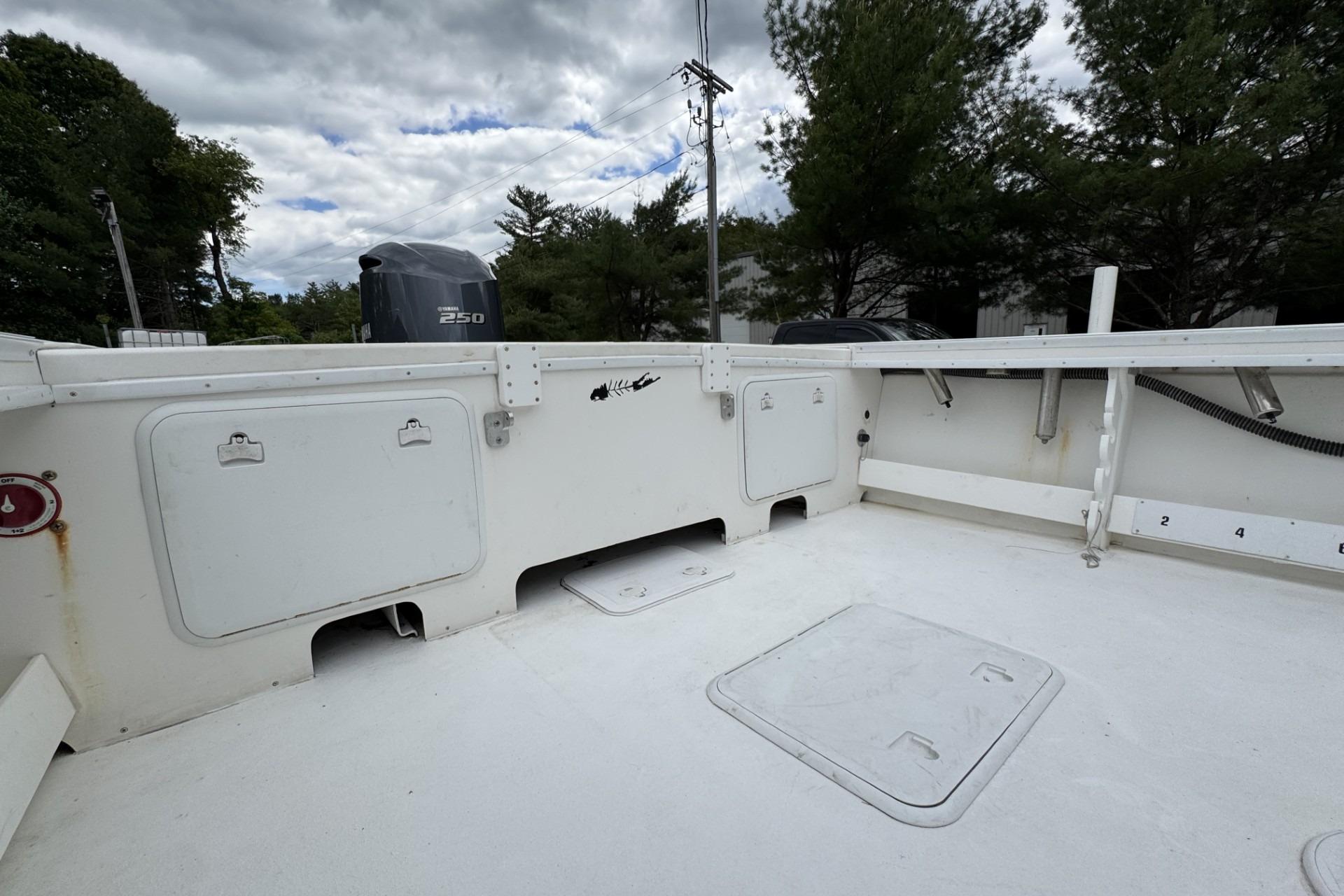 2016 Steiger Craft 25 Chesapeake boat deck with Yamaha 250 engine, under cloudy sky.