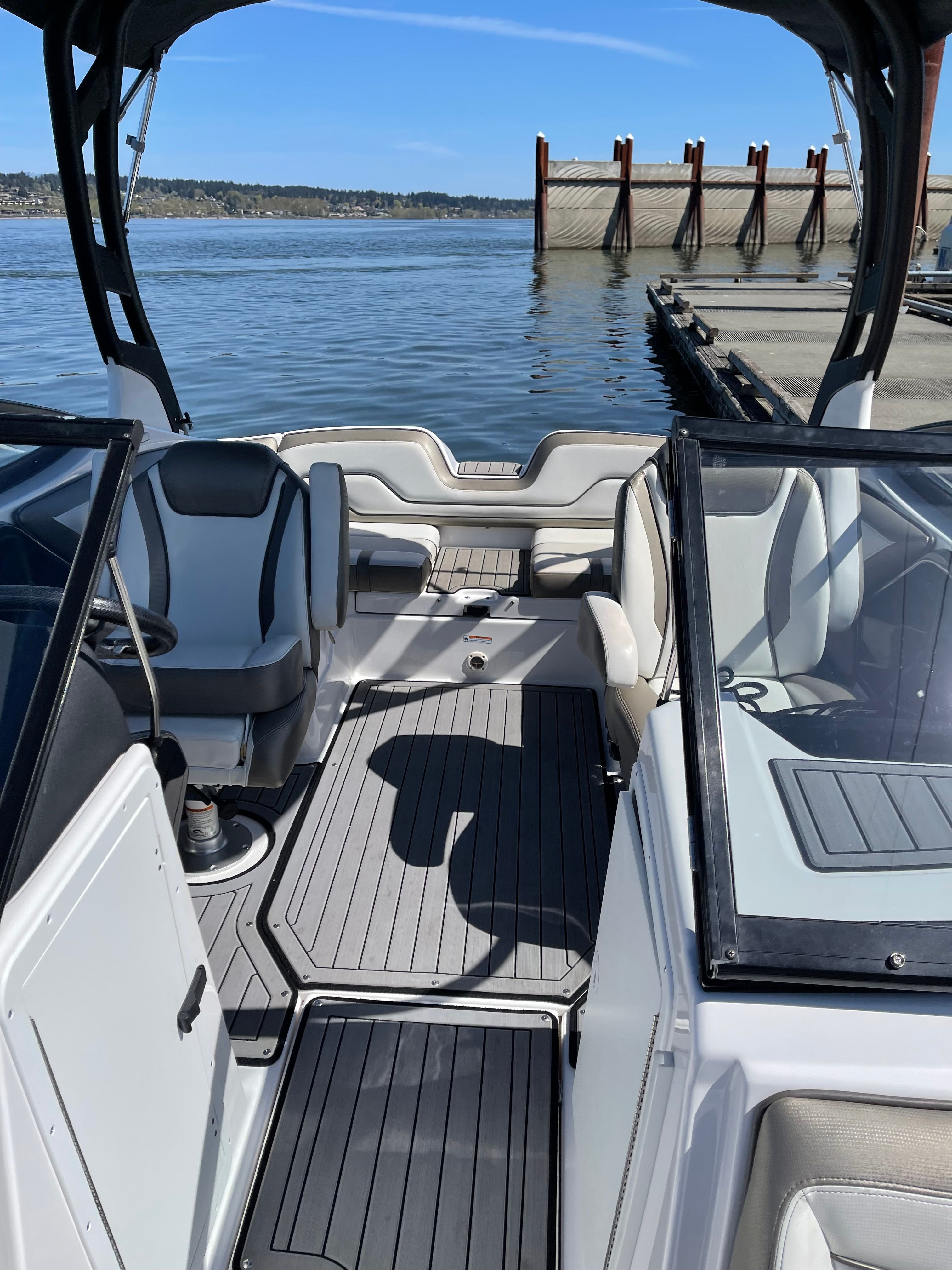 The image shows the interior of a 2018 Yamaha 212 Limited S boat docked by the water.