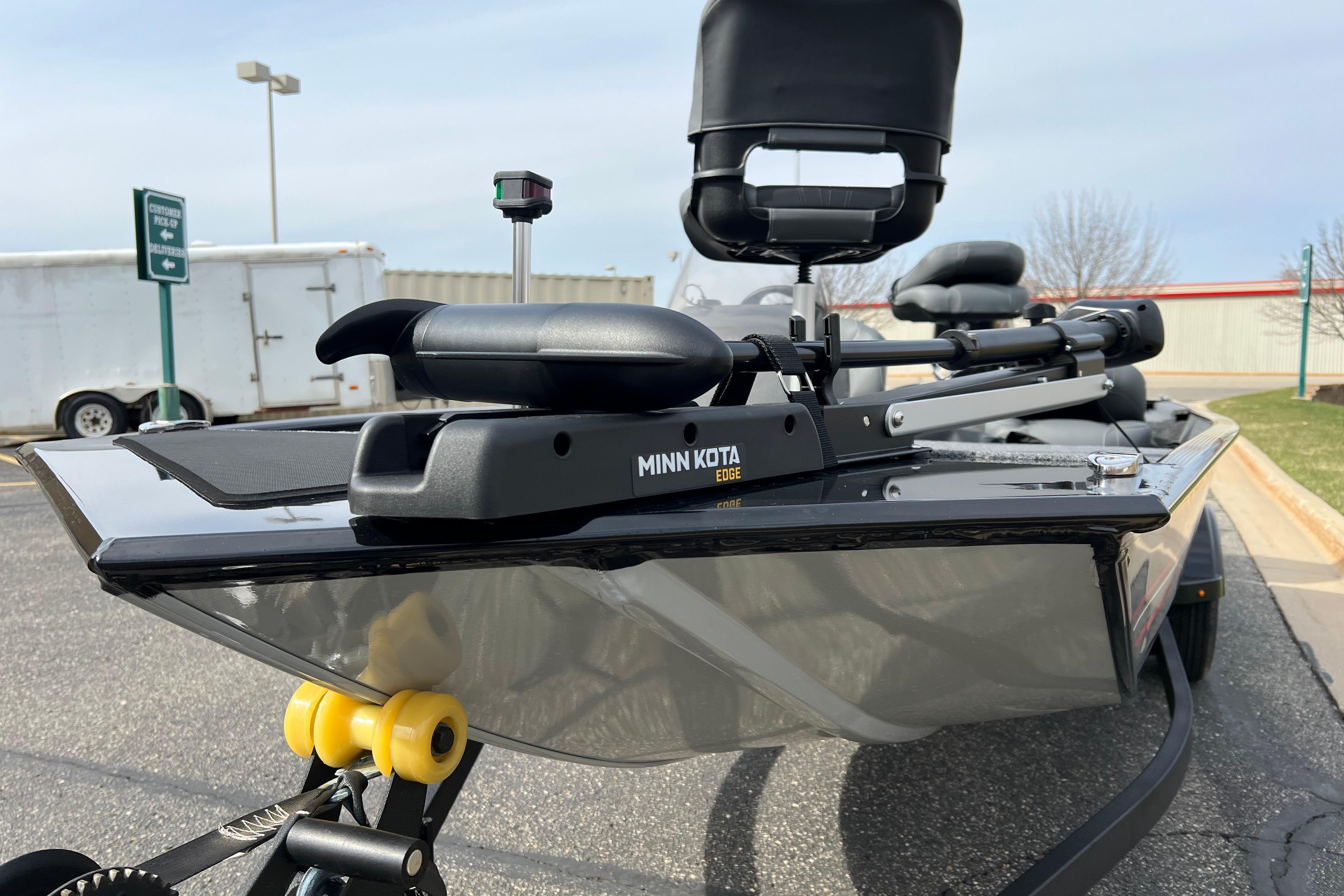 2026 Tracker Bass Tracker Classic XL with Minn Kota Edge trolling motor in parking lot.