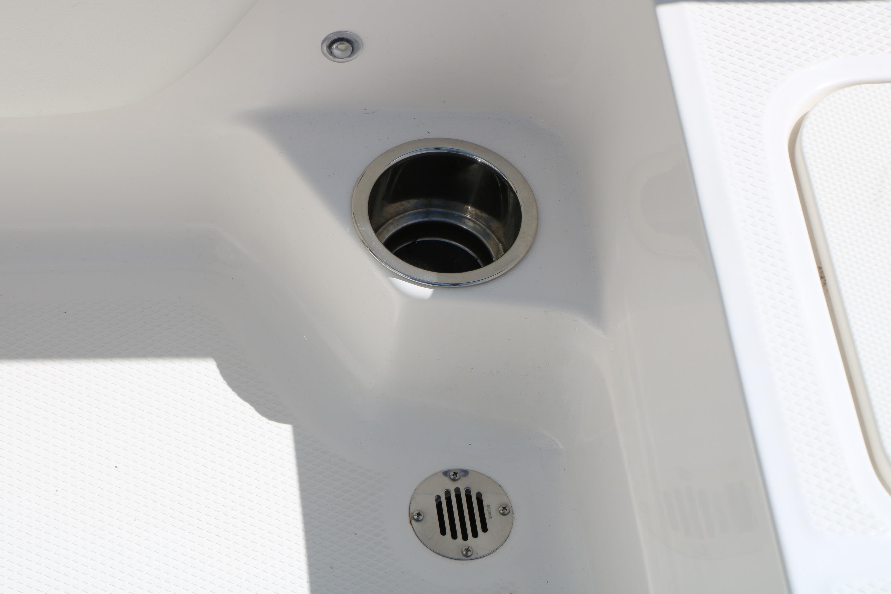 2025 Chaparral 21 SSi Ski & Fish boat drain detail, showcasing sleek design.