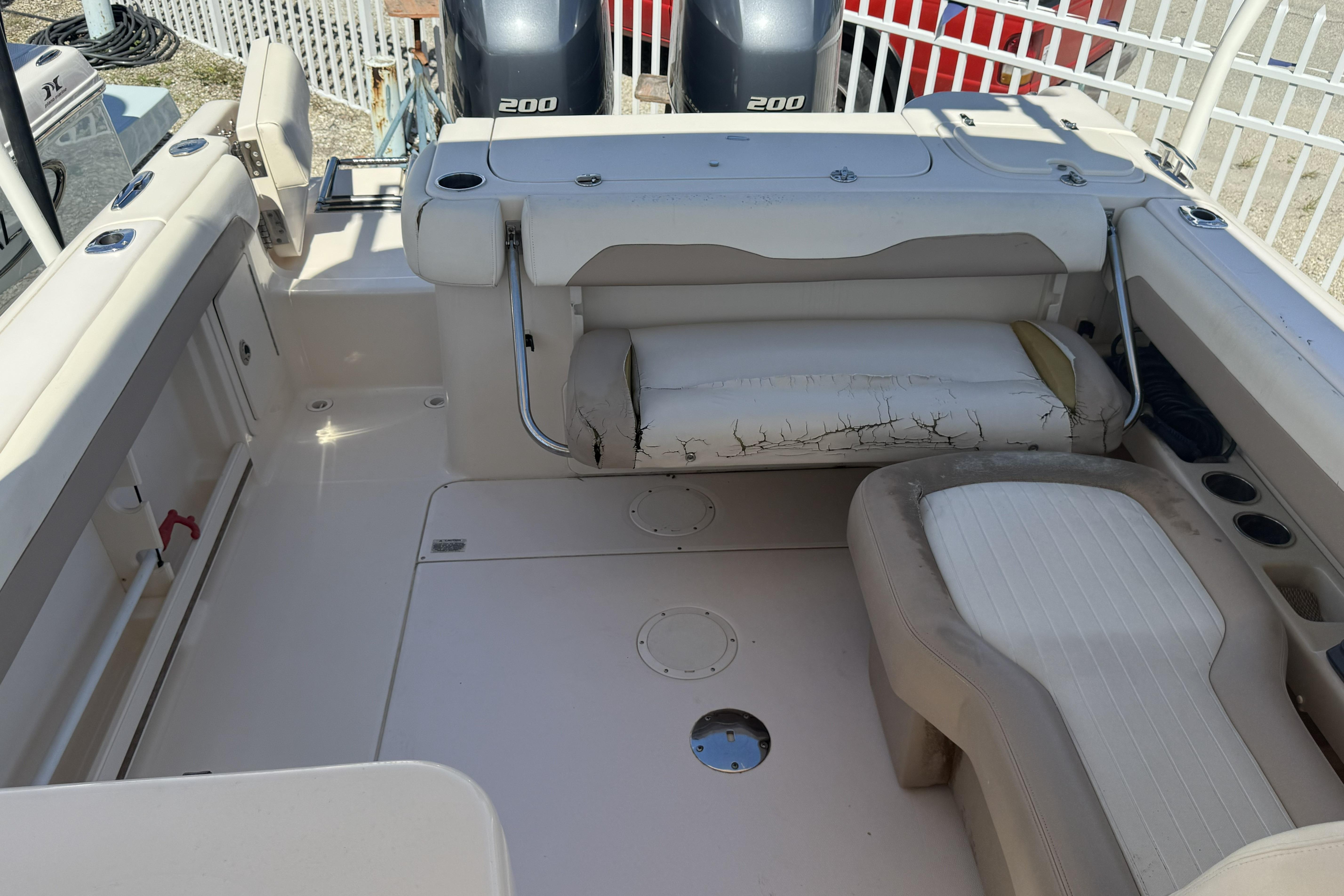 2014 Grady-White Freedom 275 boat interior with seating and dual 200 engines.