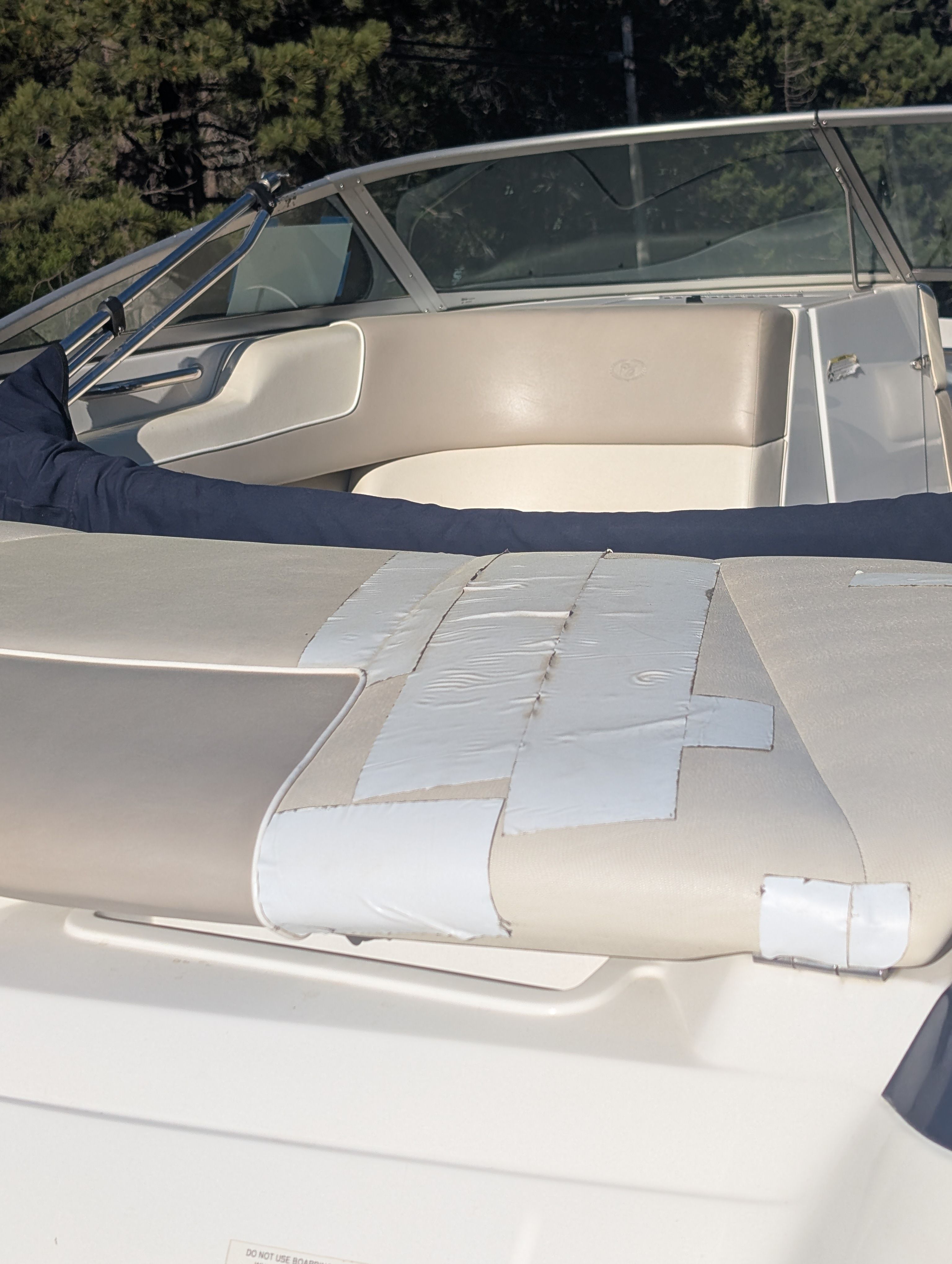The image shows the cockpit of a Cobalt 190 boat with beige upholstery.