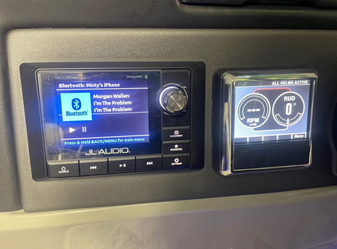 Close-up of a JL Audio system and digital display on a boat.