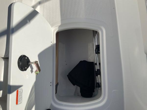 Open storage compartment on 2025 Tahoe T18 boat.
