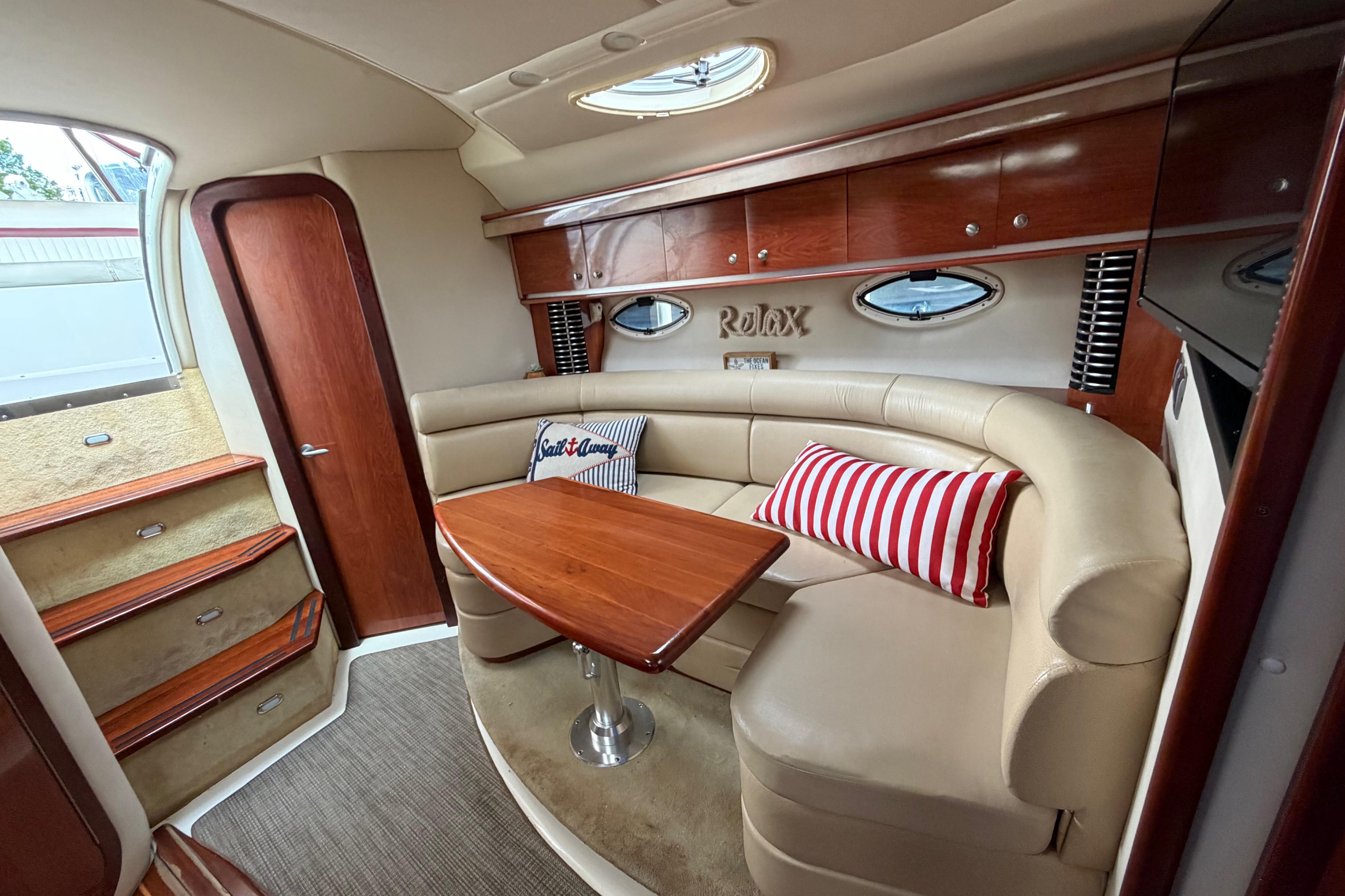 Luxurious interior of a 2007 Monterey 350 Sport Yacht with plush seating and elegant wood finishes.