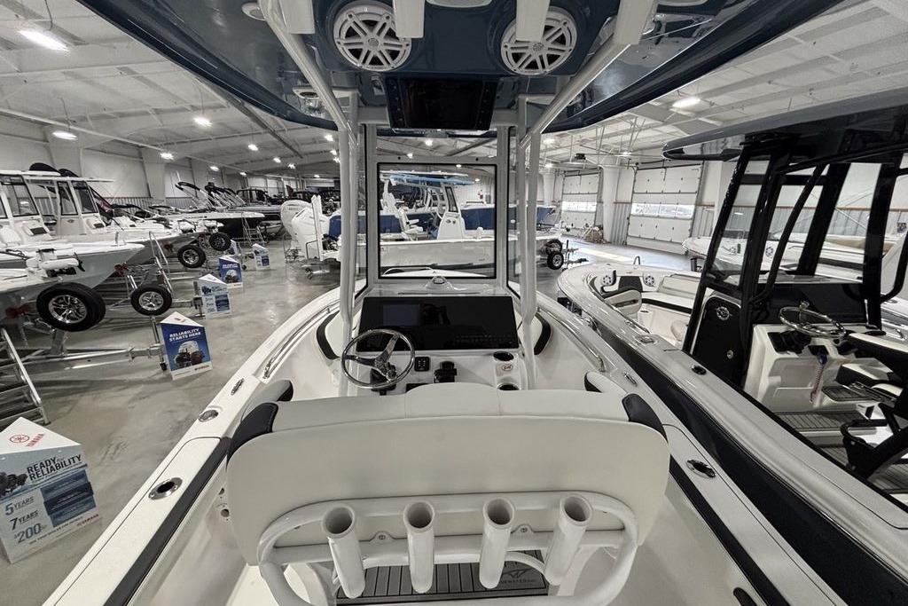 2026 Tidewater 198 CC Adventure boat interior in a showroom, showcasing modern design and features.