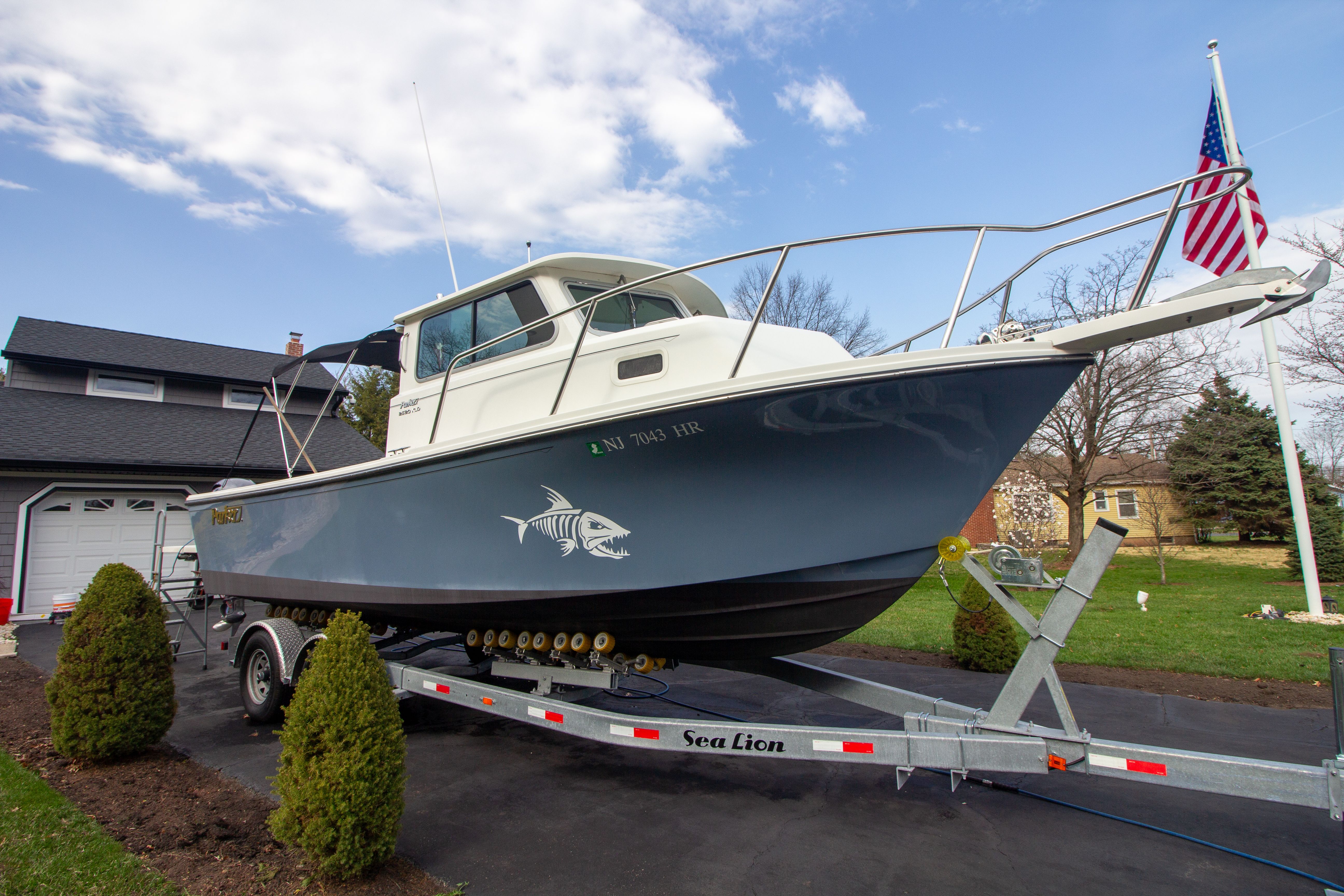 2022 Parker 2520 XLD Sport Cabin on trailer in driveway.
