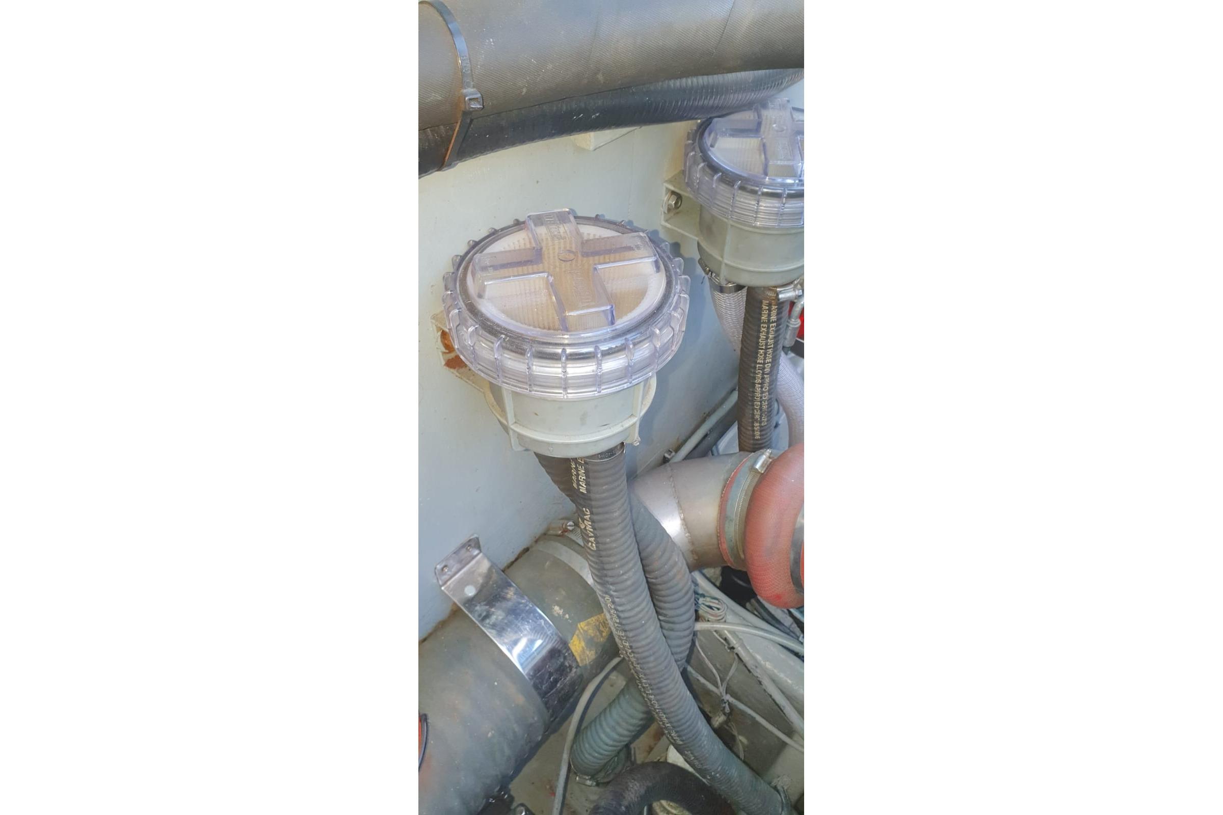 Engine components of a 1989 Fairey Spearfish MKIII, featuring hoses and filters.
