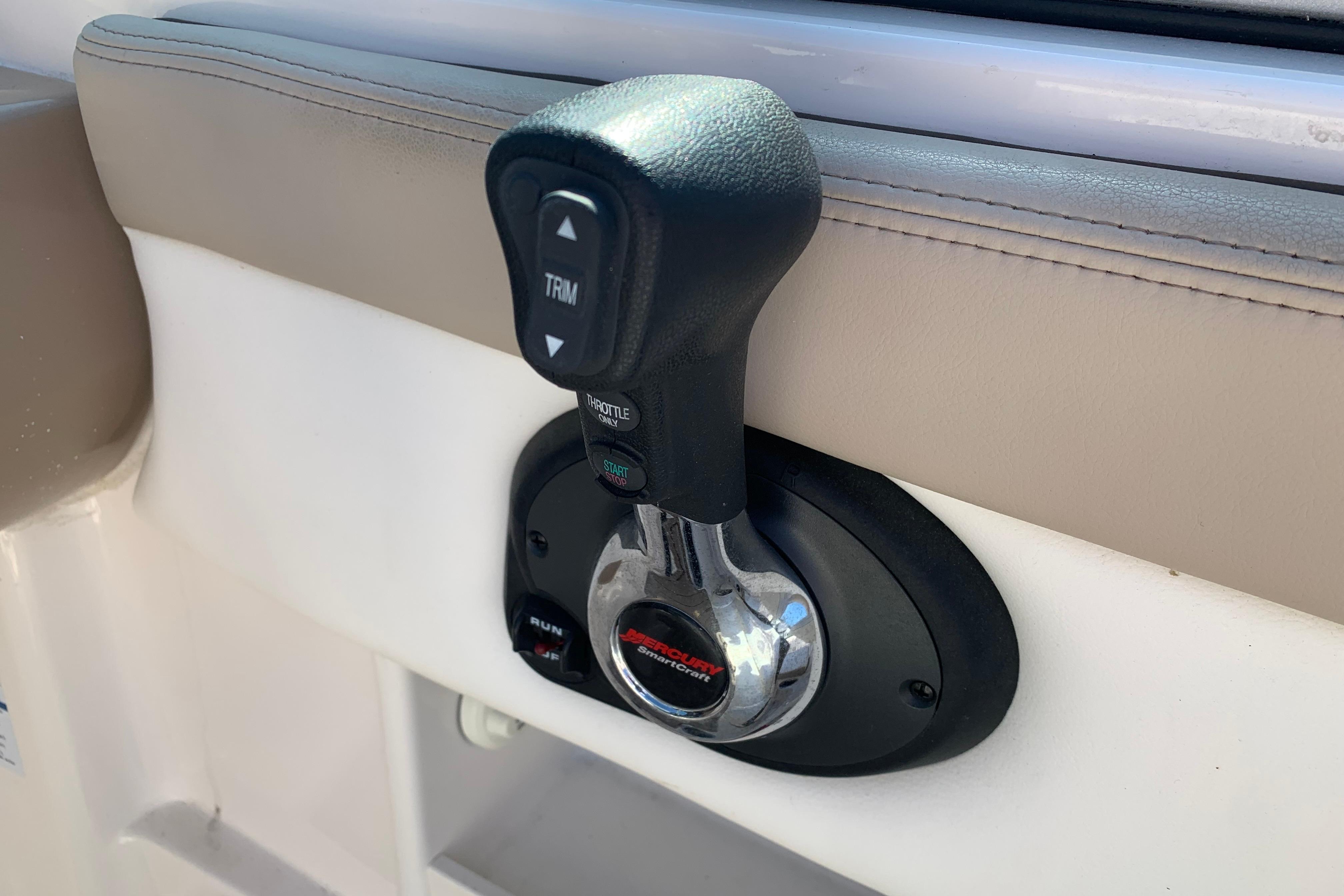 Throttle control lever on a 2022 Chaparral 23 SSi boat interior.