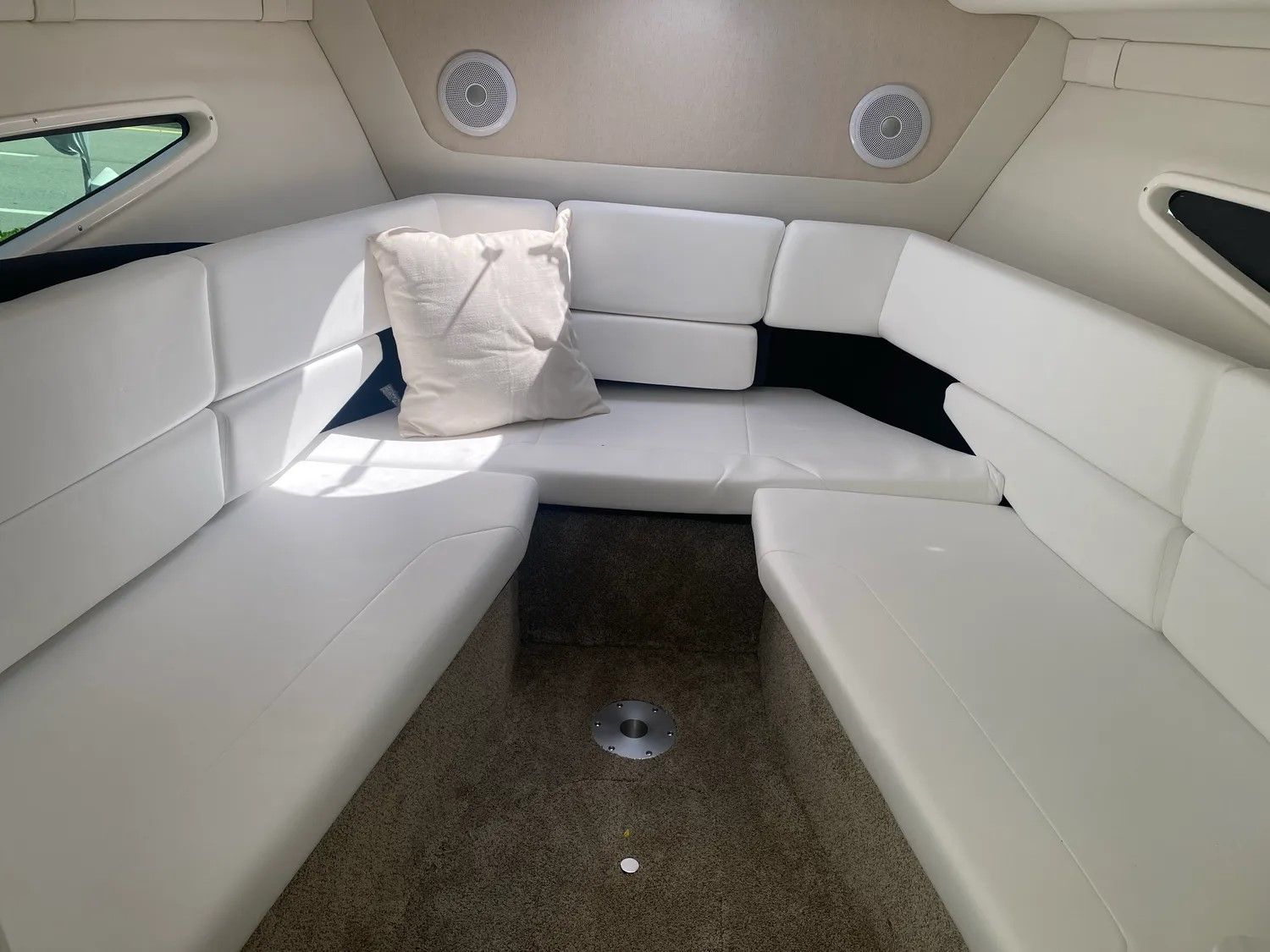 Interior of 2026 Regal 26 XO yacht with white upholstery.