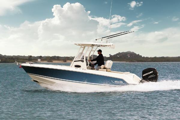 Manufacturer Provided Image: 2024 Boston Whaler 230 Outrage boat cruising on a sunny day