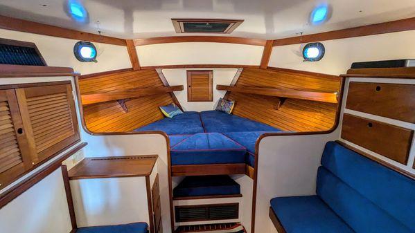 Interior of 1990 Stanley 36' Downeast Fly Bridge Cruise with cozy wooden cabin.