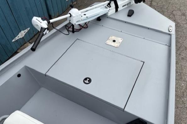2026 Tracker Bass Tracker Classic CC boat deck with trolling motor and storage compartment.