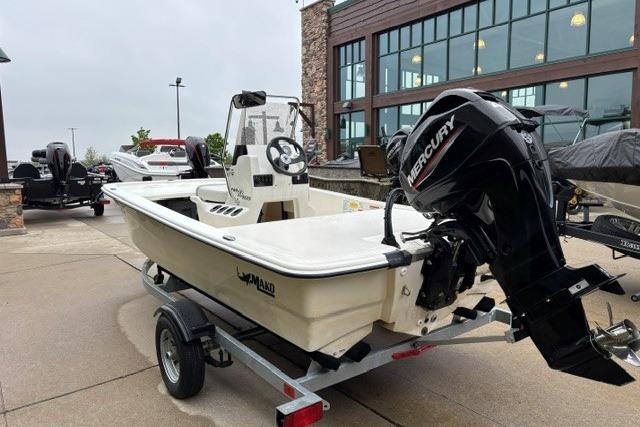 2025 Mako Pro Skiff 13 CC boat with Mercury engine on trailer.