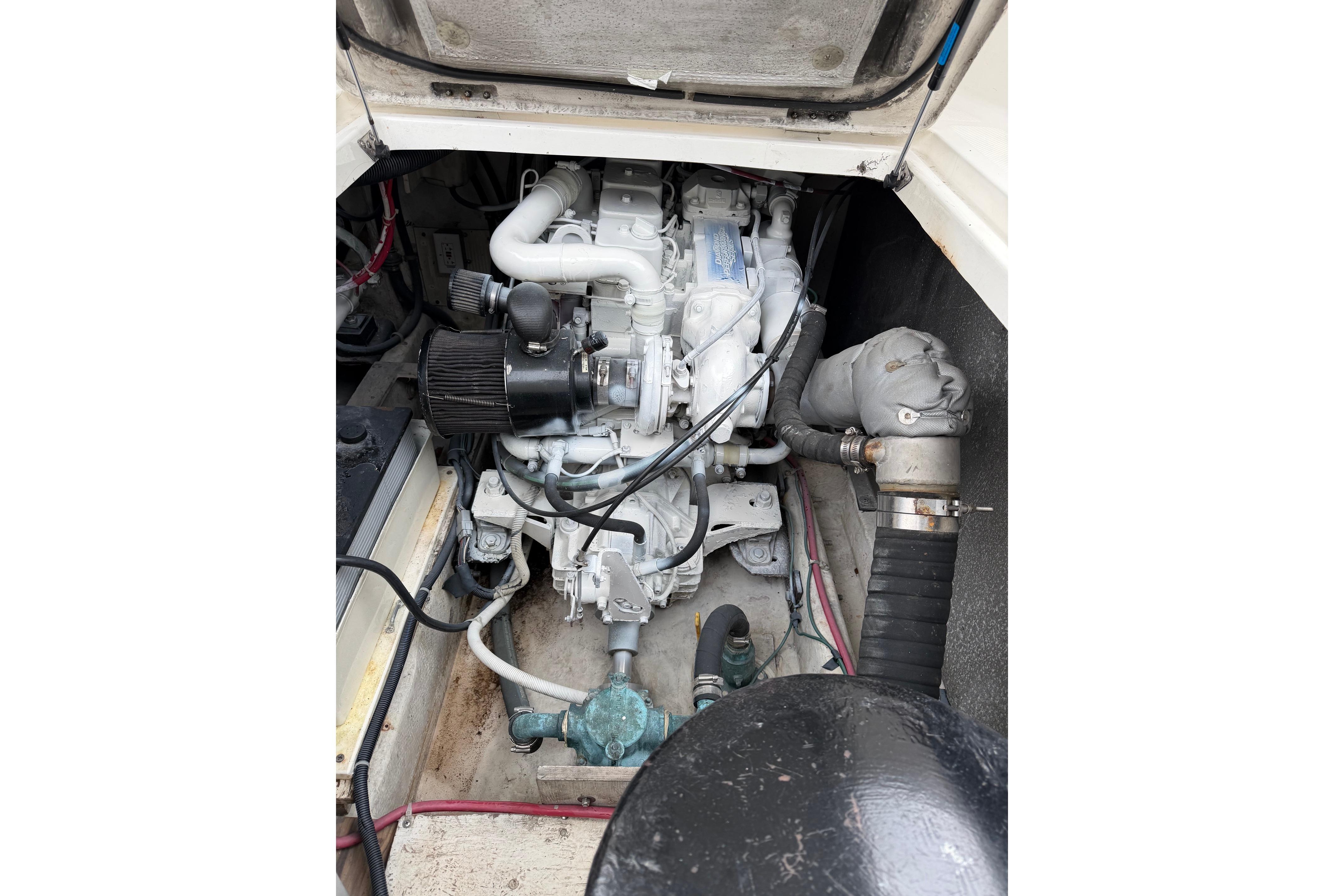 Engine compartment of 1998 Bayliner 3388 Command Bridge Motoryacht, showcasing mechanical components.