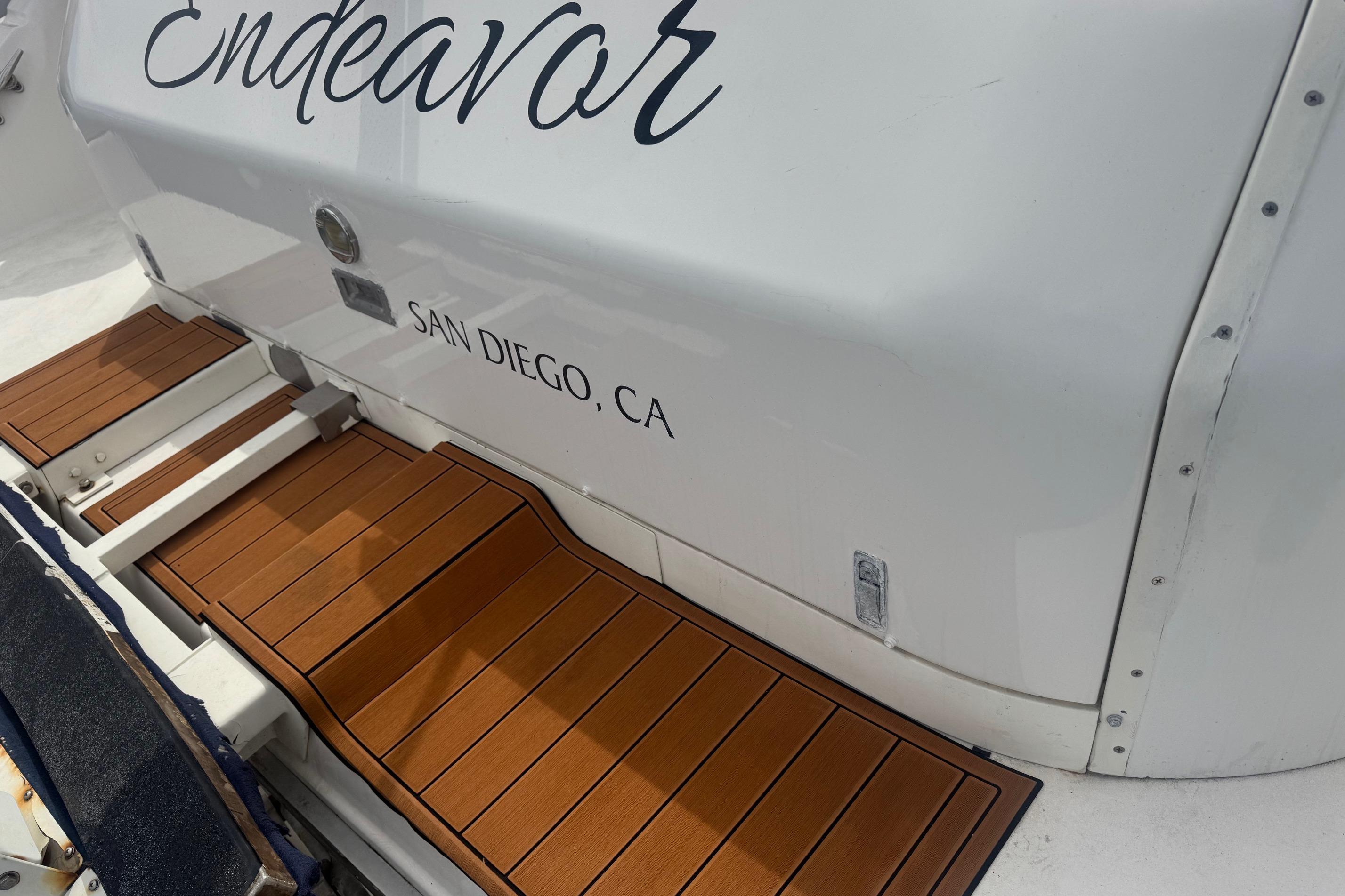 1994 Sea Ray 44 Express Bridge boat with teak deck, named Endeavor, docked in San Diego.