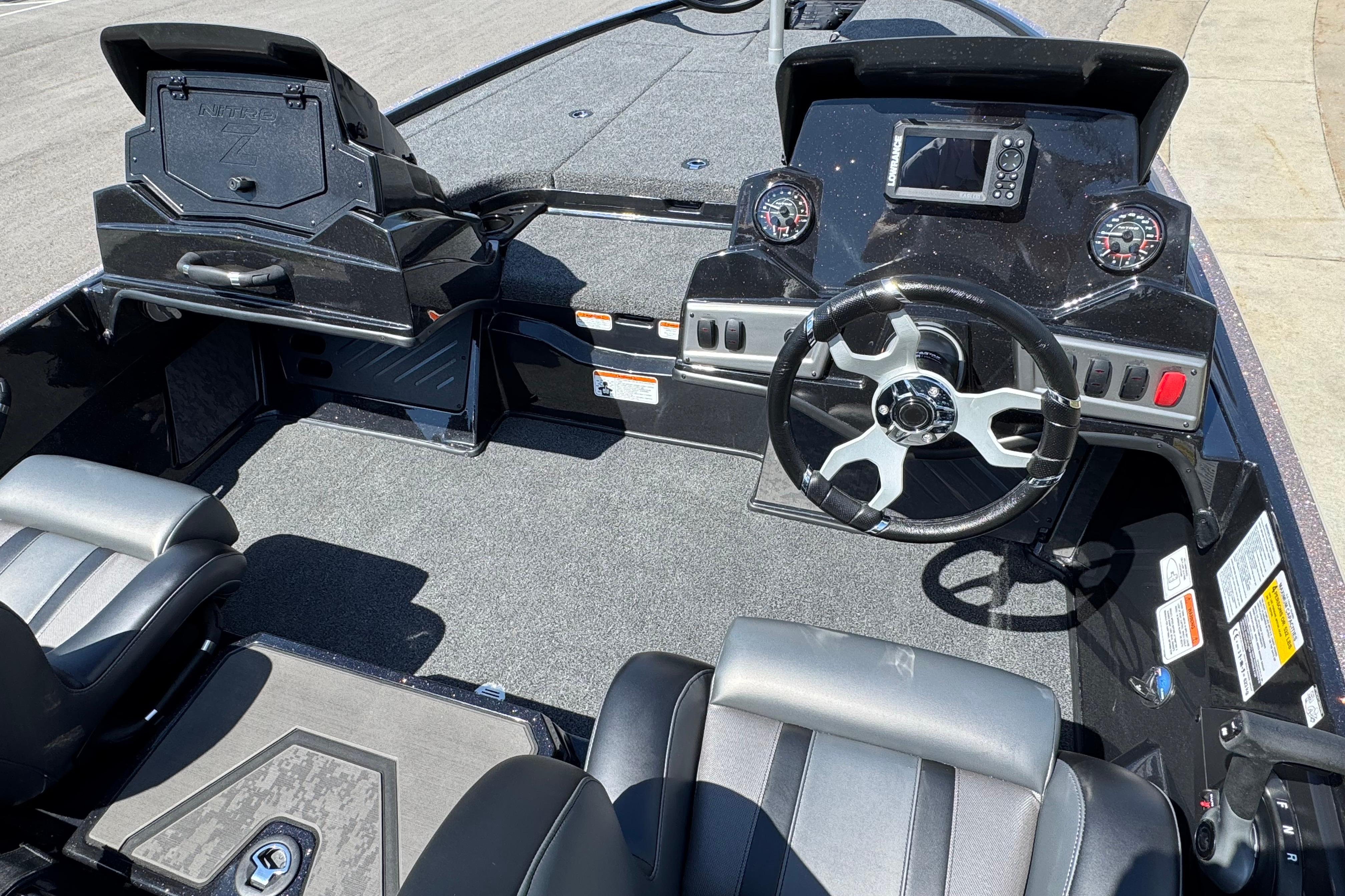Interior of a 2026 Nitro Z19 XL boat featuring steering wheel and dashboard controls.