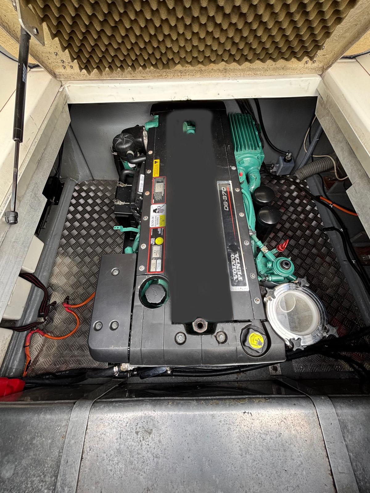 Engine compartment of a 1990 Sunseeker Portofino 31 boat, showcasing detailed components.