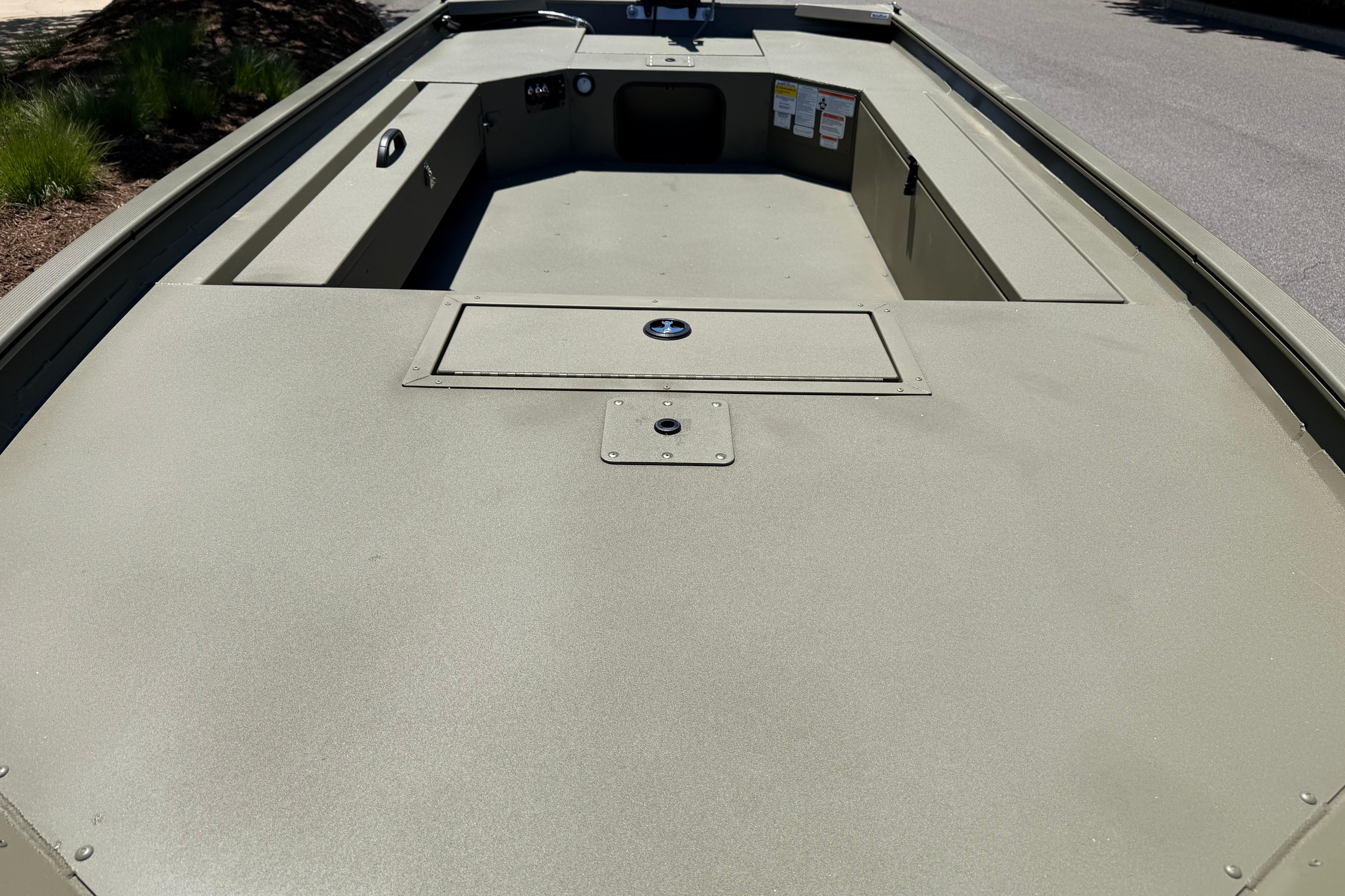 2026 Tracker Grizzly 1654 T Sportsman boat interior, featuring spacious deck and storage compartments.
