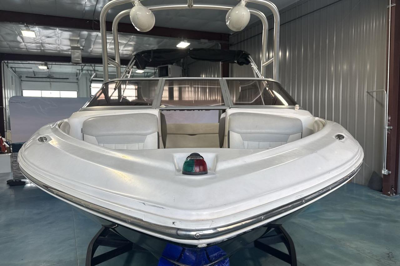 2012 Regal 1900 Bowrider boat in indoor storage, front view.