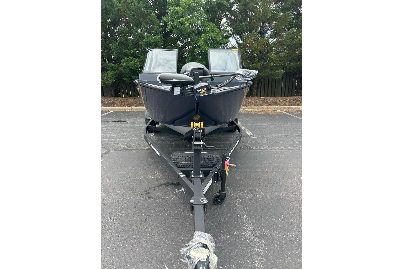 2025 Tracker Pro Guide V-175 WT boat on trailer, parked outdoors.