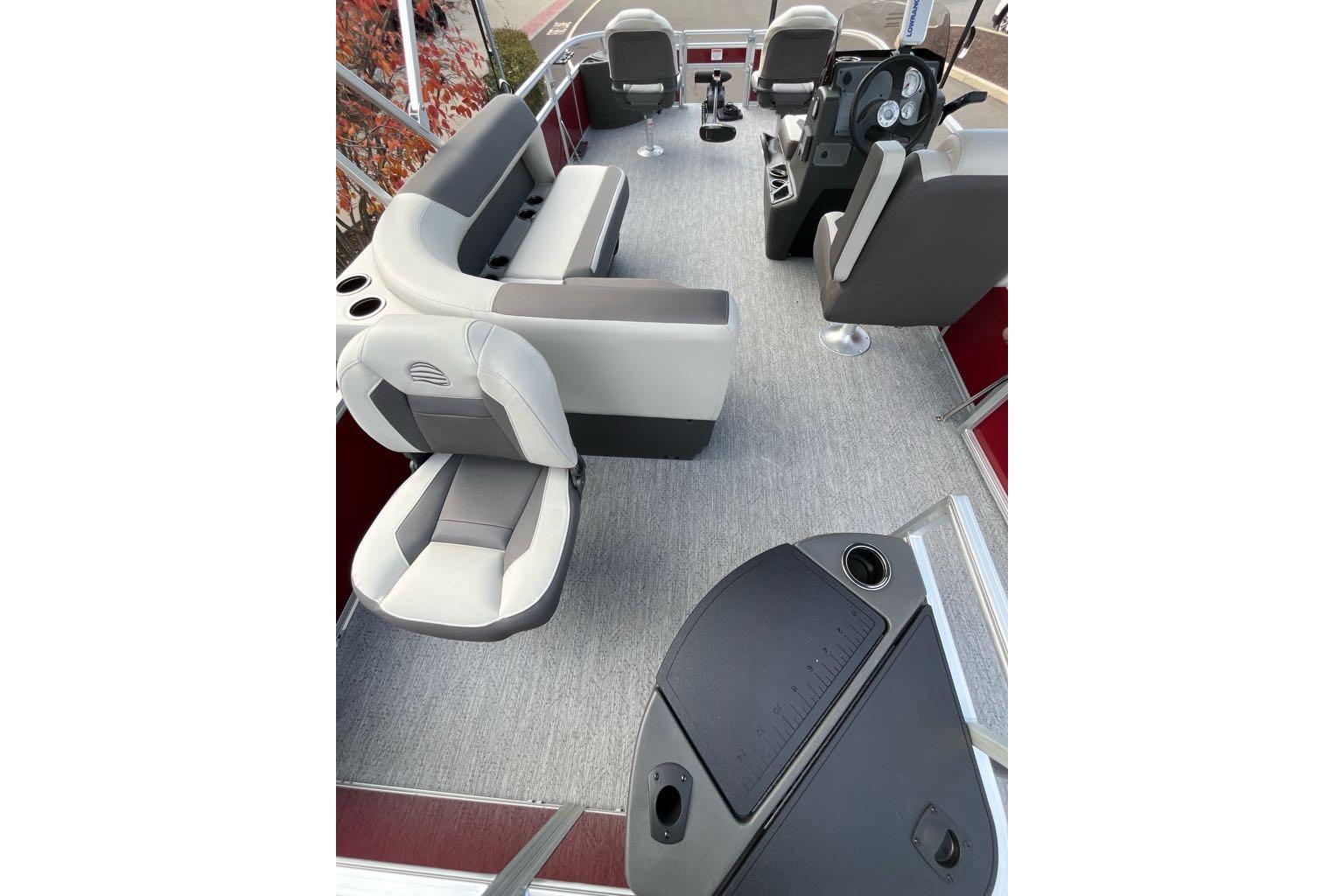 2026 Sun Tracker Bass Buggy 18 DLX interior with gray seating and steering console.
