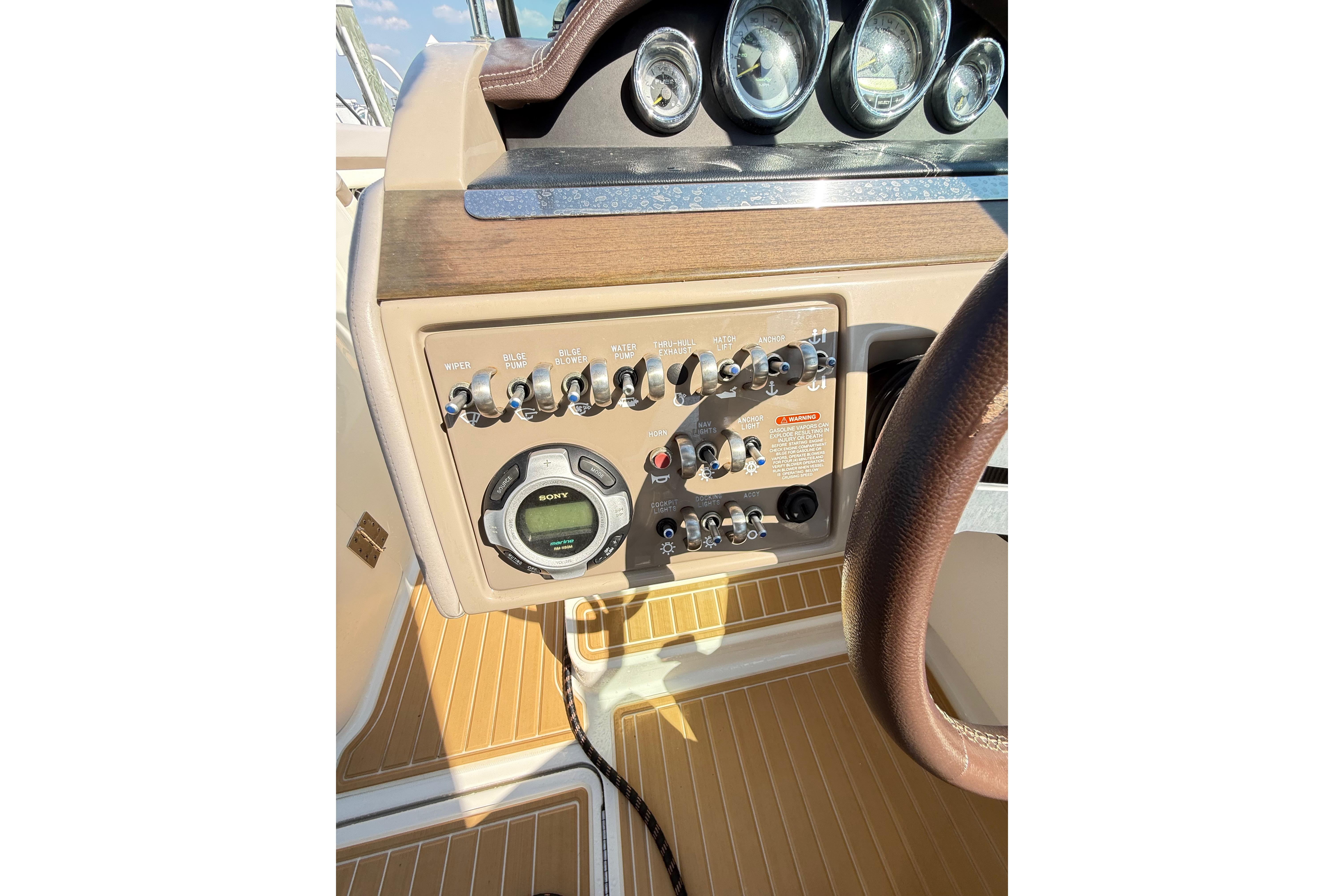 Dashboard of a 2011 Sea Ray 270 SLX boat with control panel and gauges.