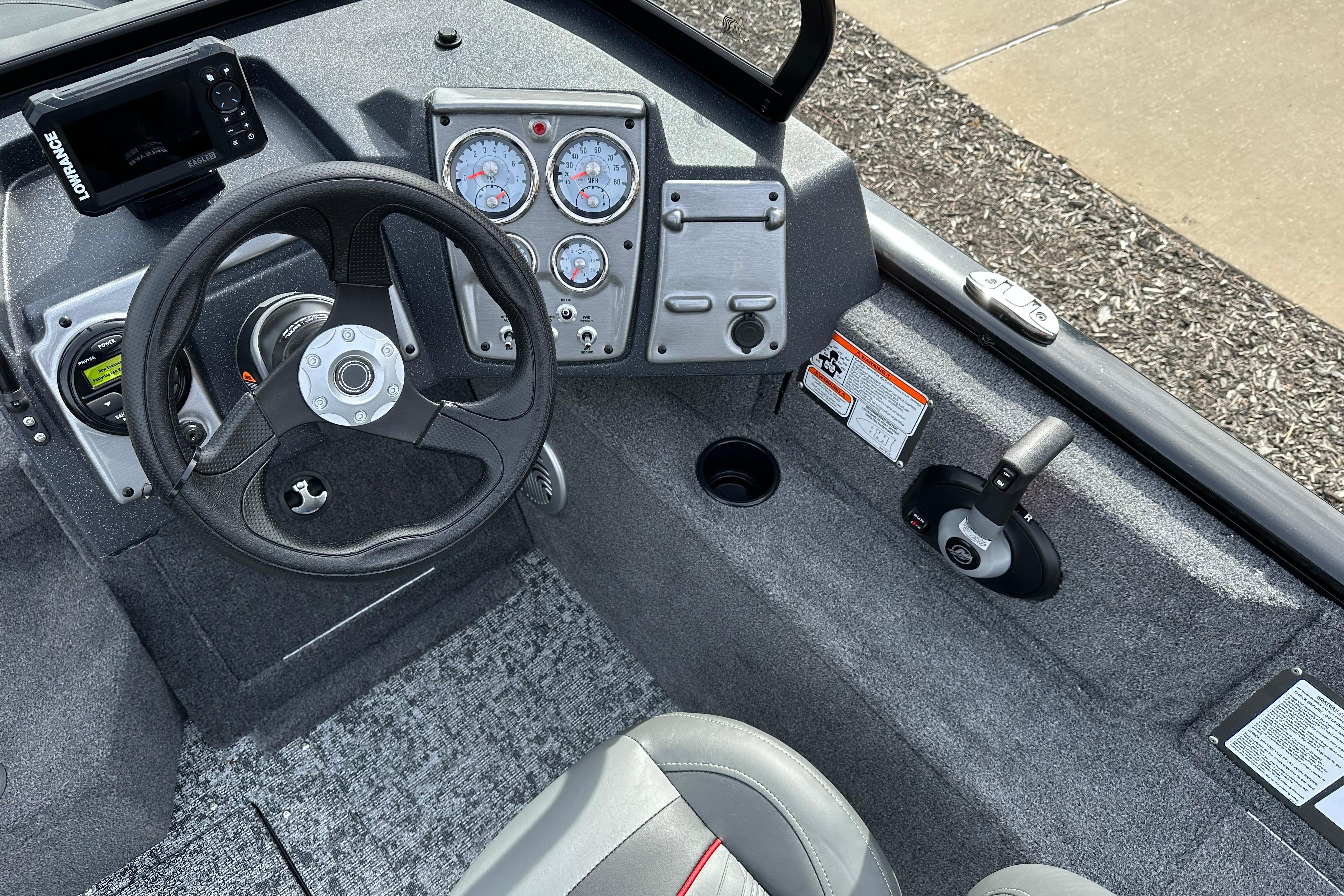 2026 Tracker Pro Guide V-175 Combo boat dashboard with steering wheel and gauges.
