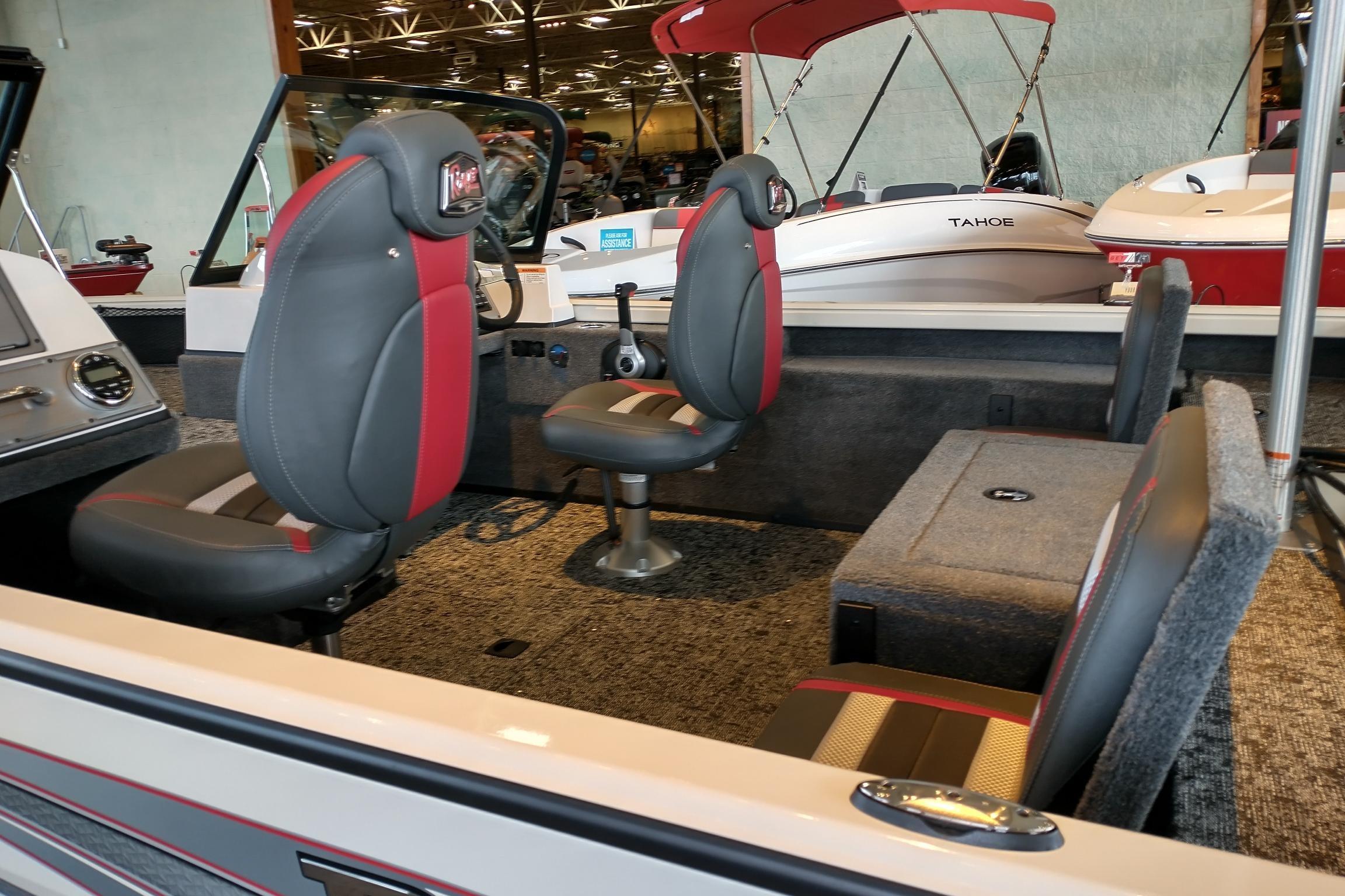 2026 Ranger VS1682SC Reata boat interior with gray and red seating, showcased indoors.
