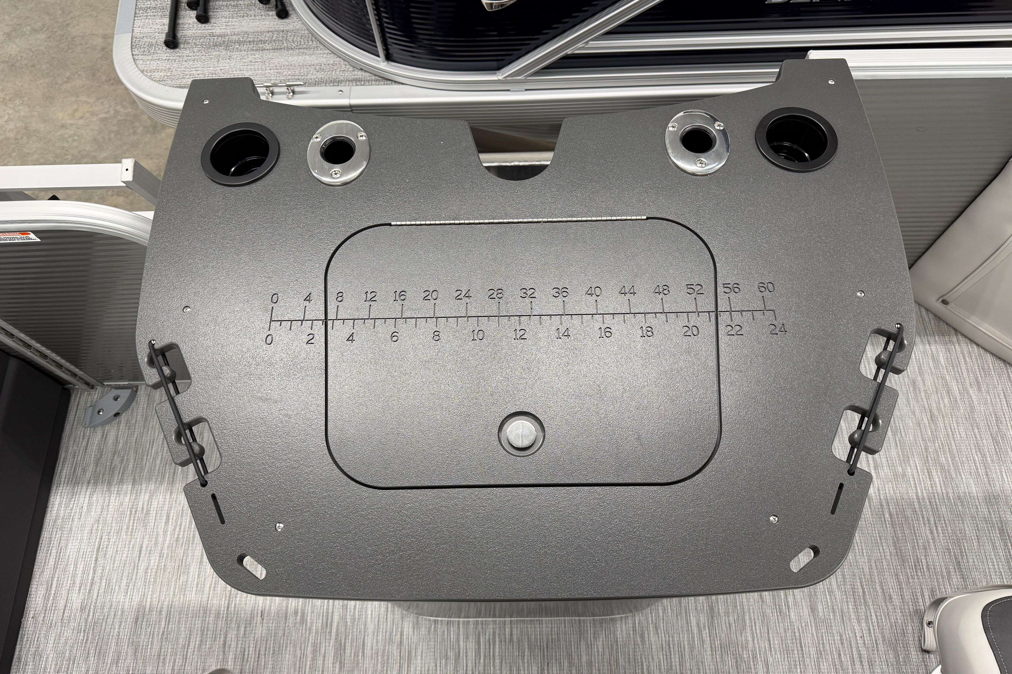 Bennington 20 SF 2026 boat console with measurement markings and cup holders.
