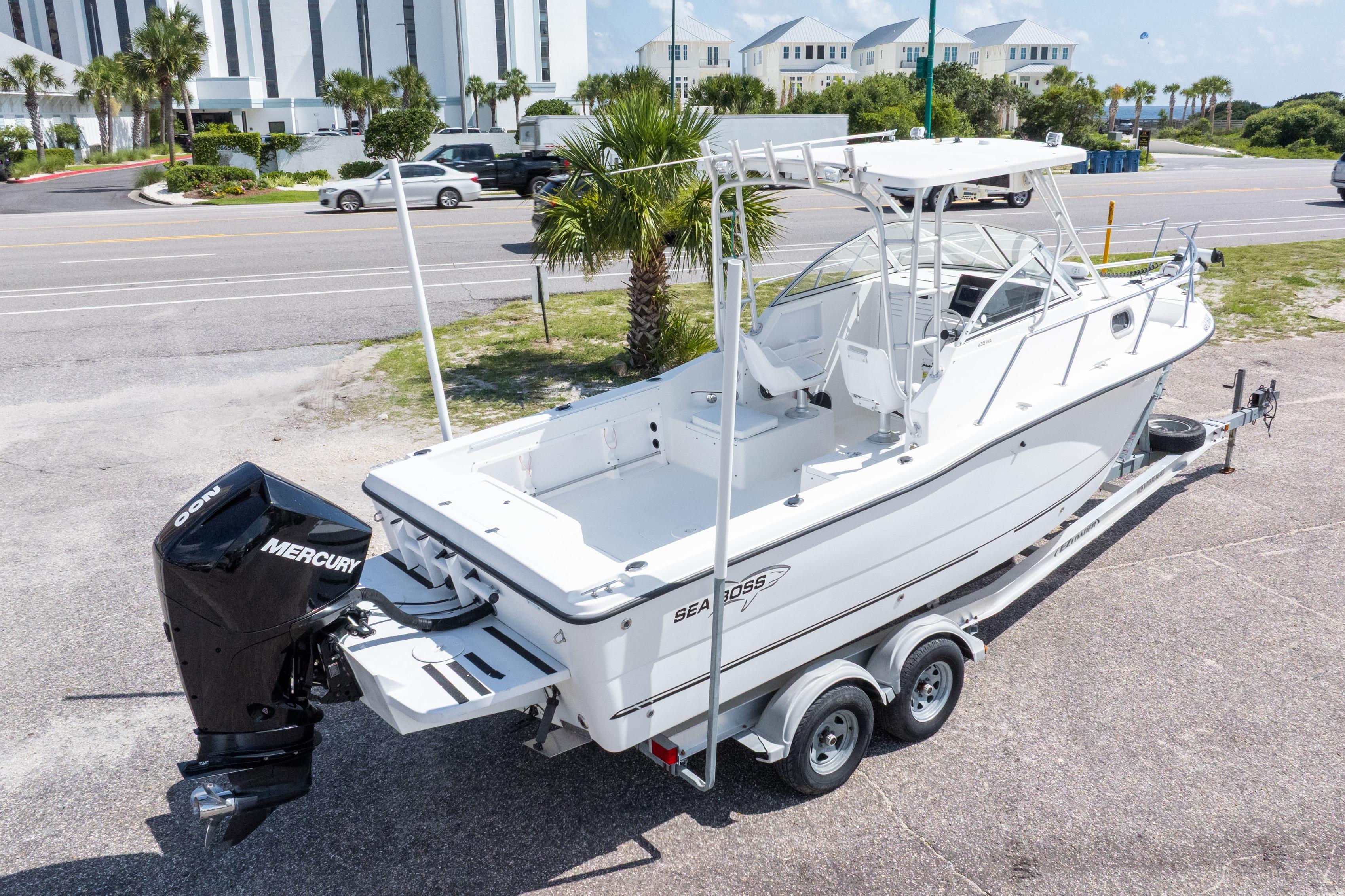 2007 Sea Boss 235 Walkaround boat on trailer with Mercury outboard motor.