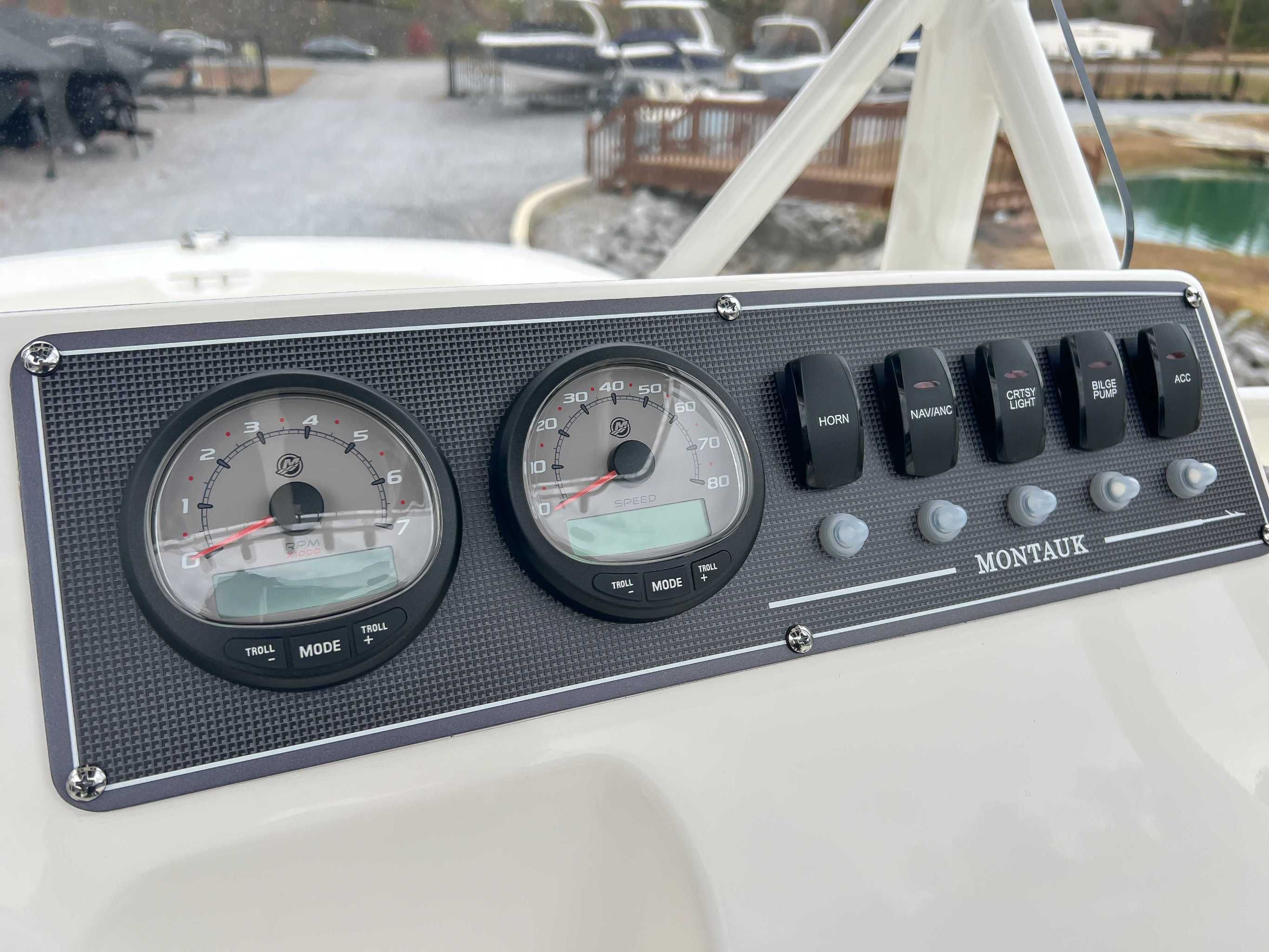 Dashboard of 2025 Boston Whaler 190 Montauk with switches and gauges.