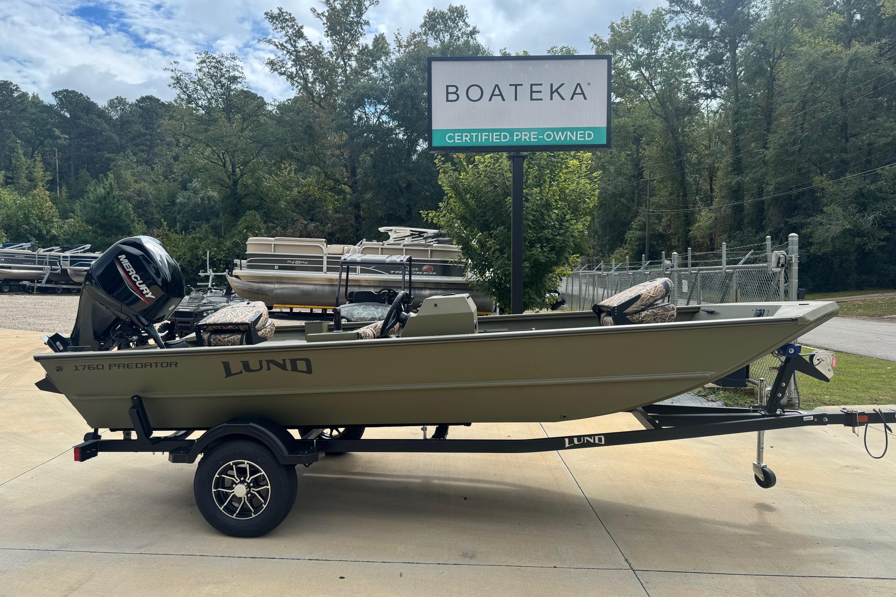 2026 Lund 1760 Predator SC boat on trailer at Boateka dealership.