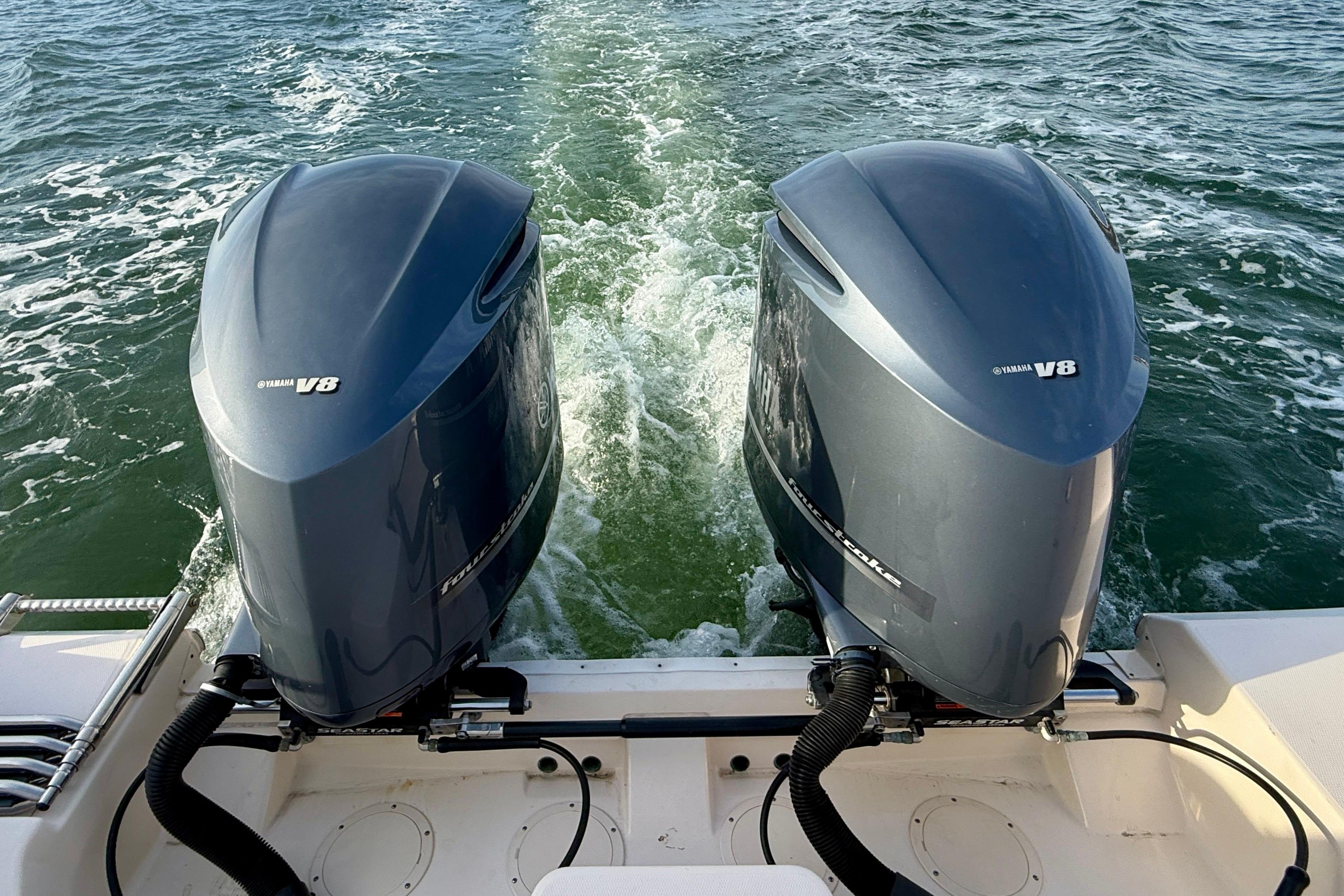 Twin Yamaha V8 engines on a 2012 Grady-White Canyon 336 boat in motion.