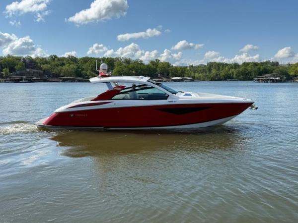 2022 Cobalt A36BR boat on a lake under a clear blue sky.