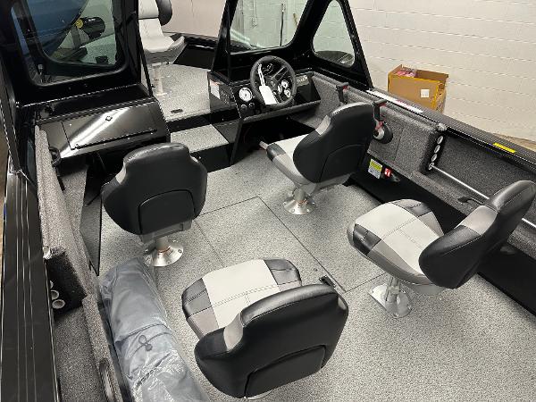 2025 Crestliner 1850 Commander boat interior with four seats and steering console.