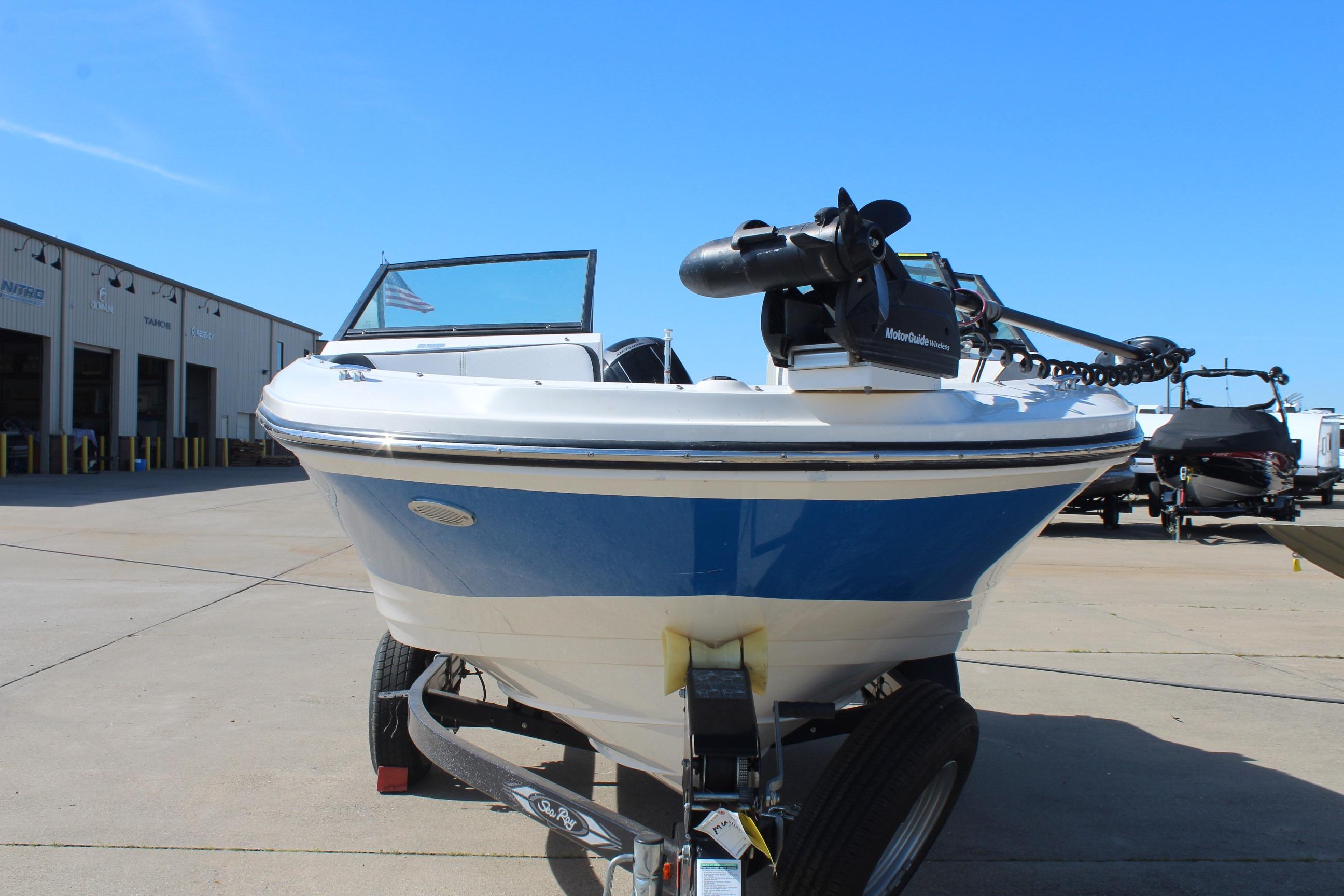 2015 Sea Ray 19 SPX OB boat on trailer, parked outdoors under clear blue sky.