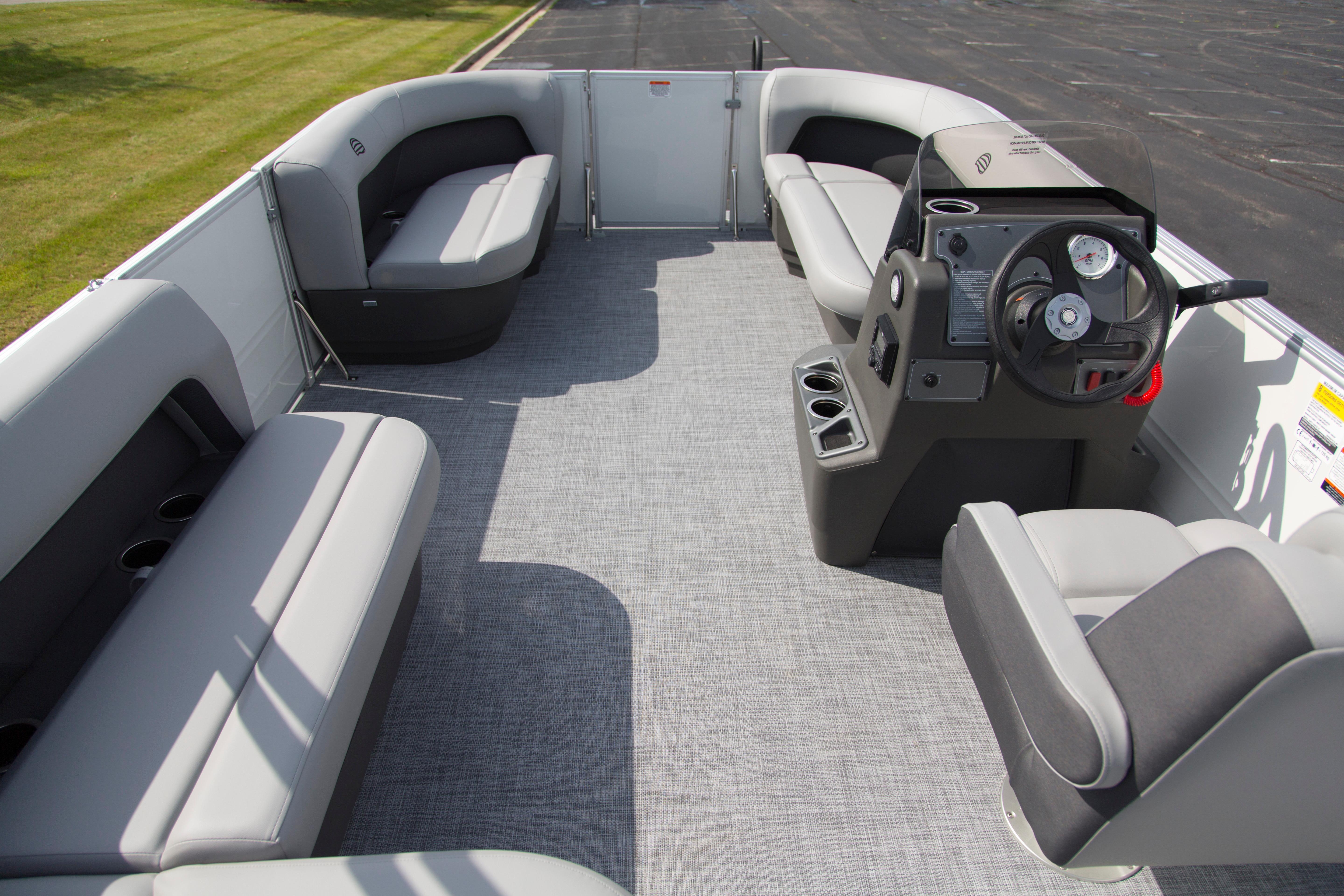 2026 Sun Tracker Party Barge 16 DLX interior with spacious seating and modern helm.