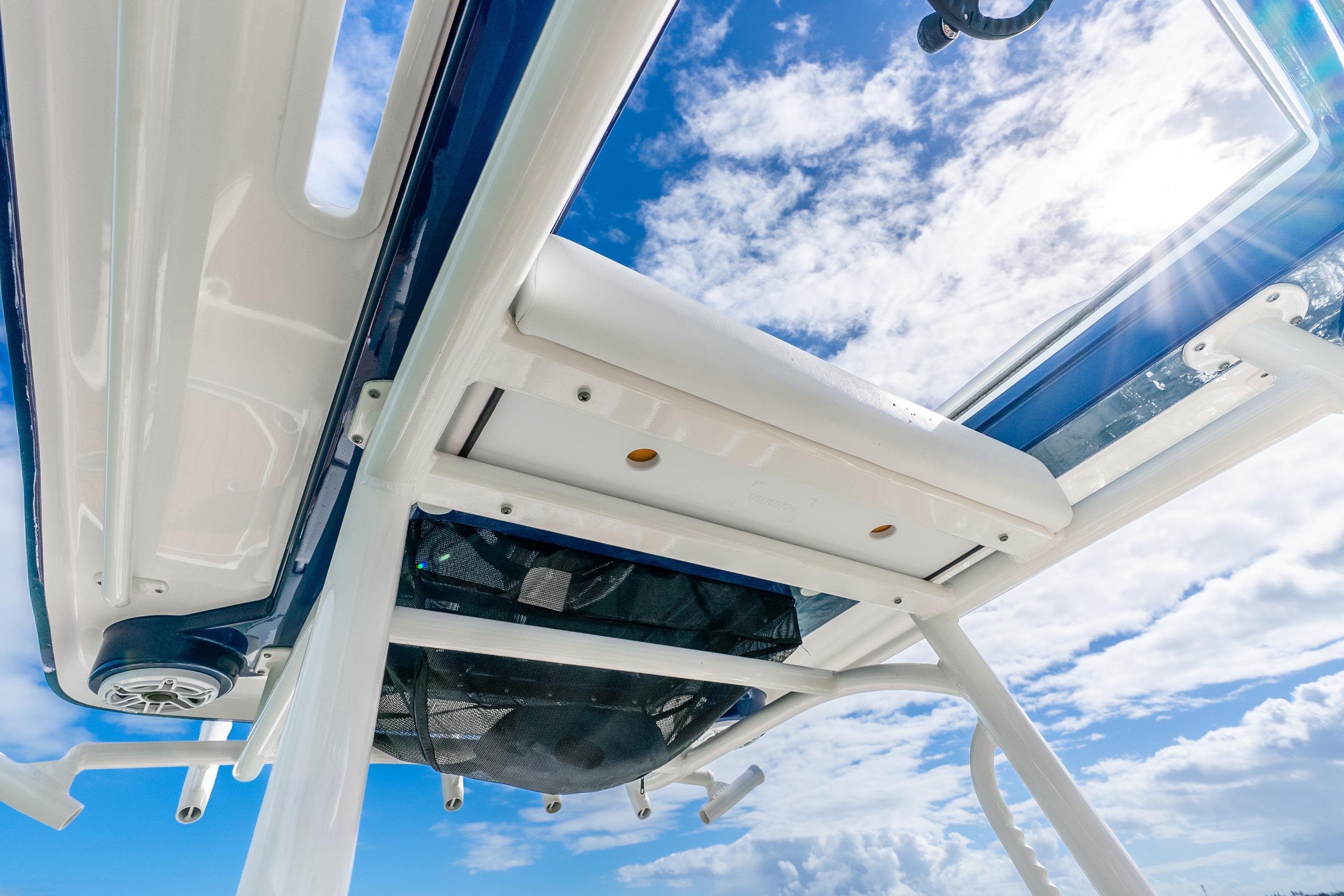 2024 Caymas 281 HB boat roof detail against a bright blue sky.