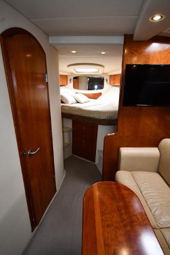 Interior of 2010 Cruisers Yachts 390 Sports Coupe, featuring cozy cabin and elegant wood finishes.