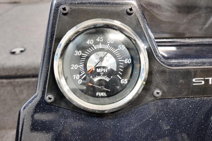 Speedometer and fuel gauge on 2024 Lowe Stinger 188 boat dashboard.