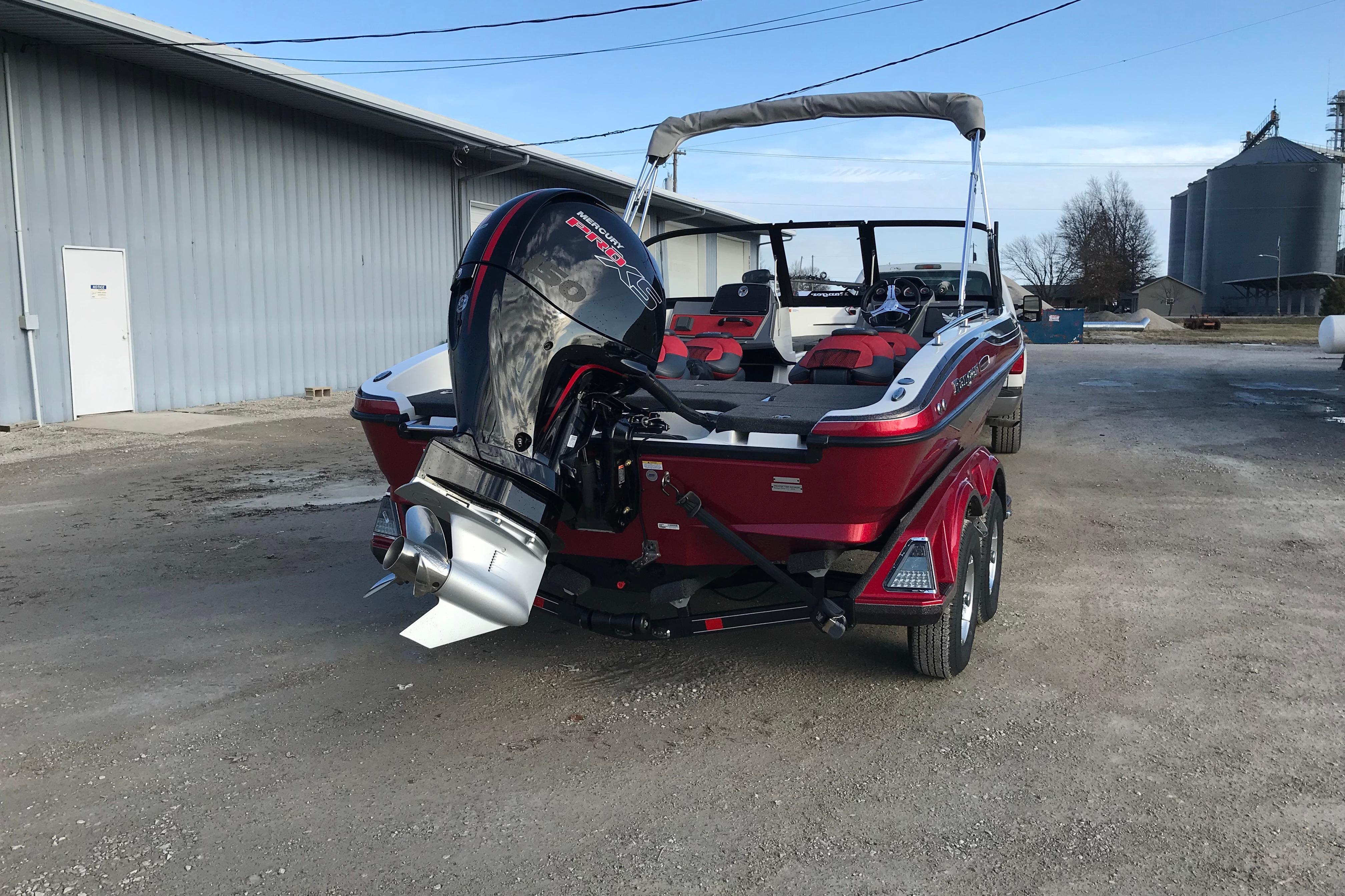 2026 Ranger 1850MS boat with powerful outboard motor, parked outdoors on a trailer.