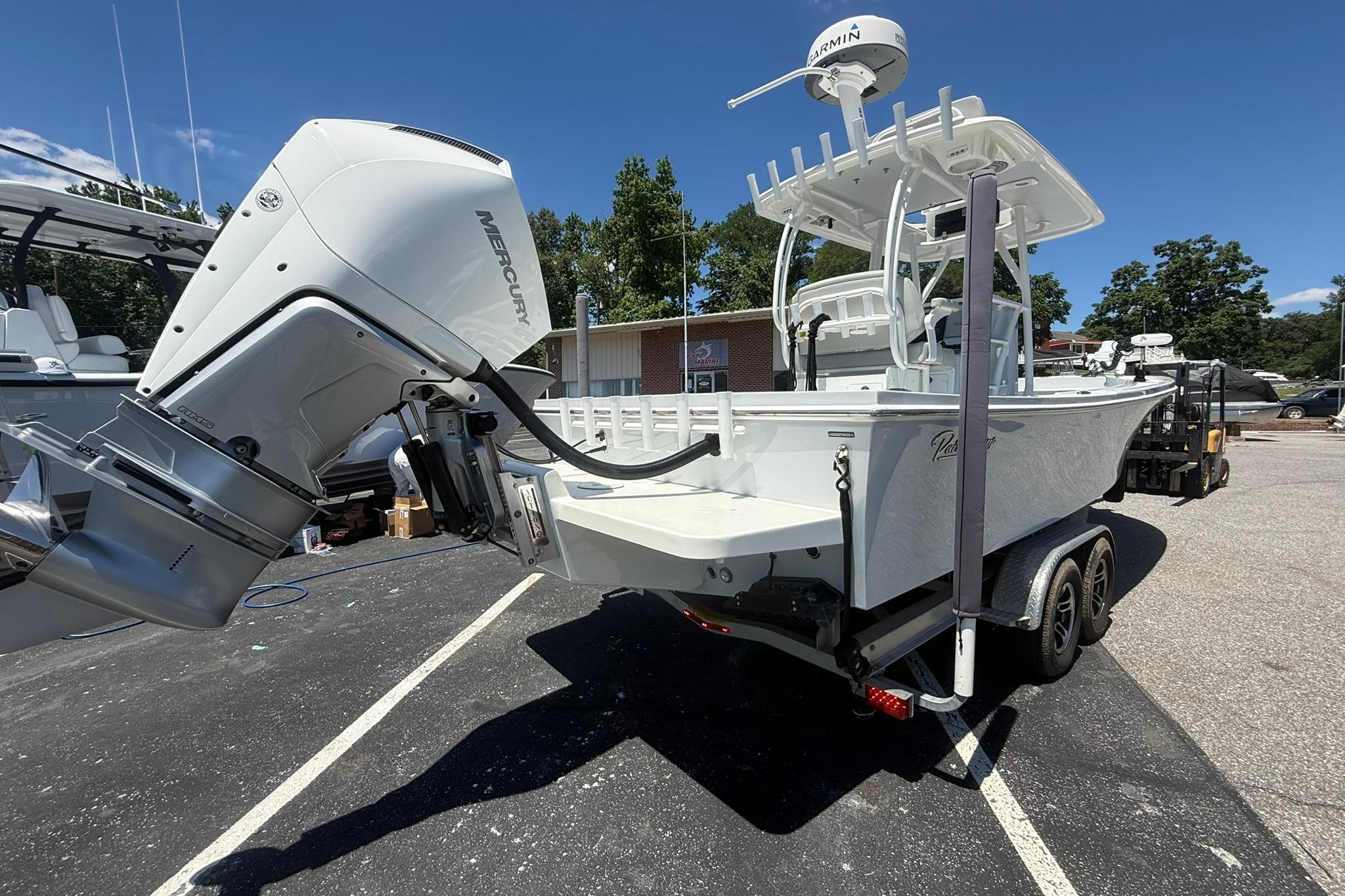 2024 Pair Customs 24 Center Console MV boat with Mercury engine on trailer.