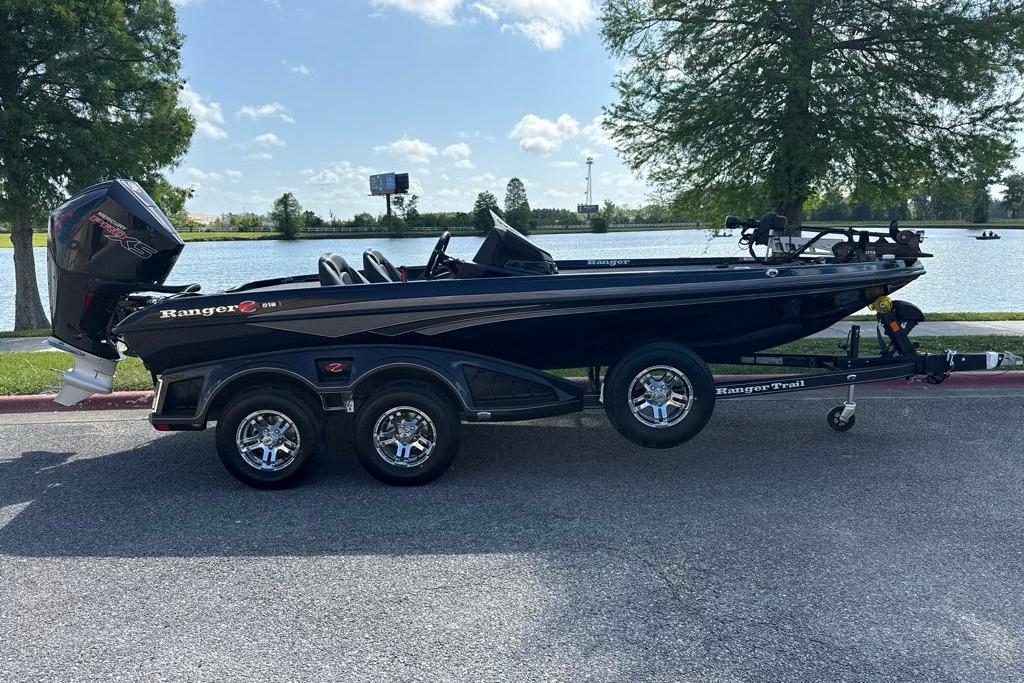 2026 Ranger Z518 boat on trailer by a lake, sunny day.