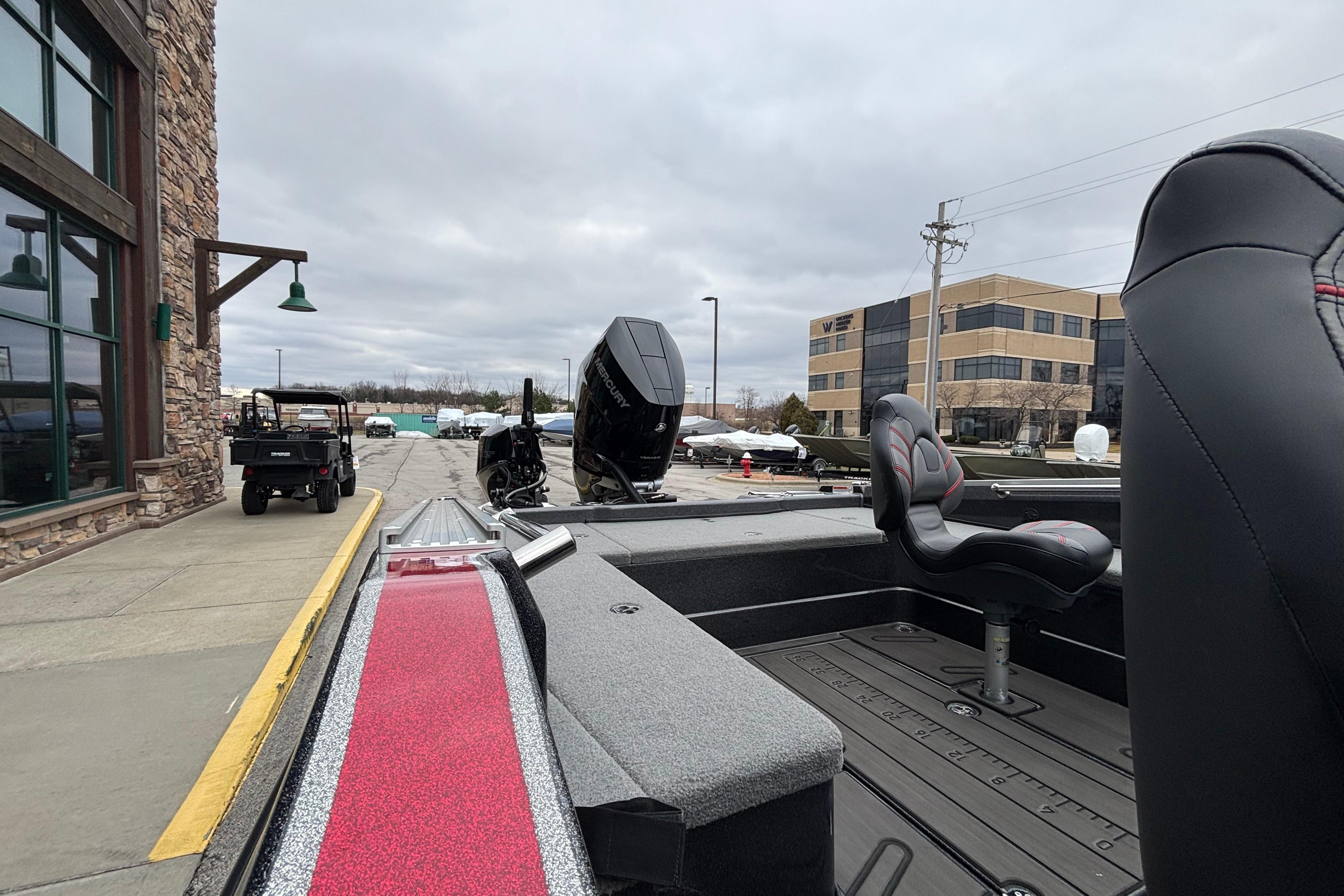 2024 Nitro ZV21 Pro boat with sleek design, parked outdoors near buildings.