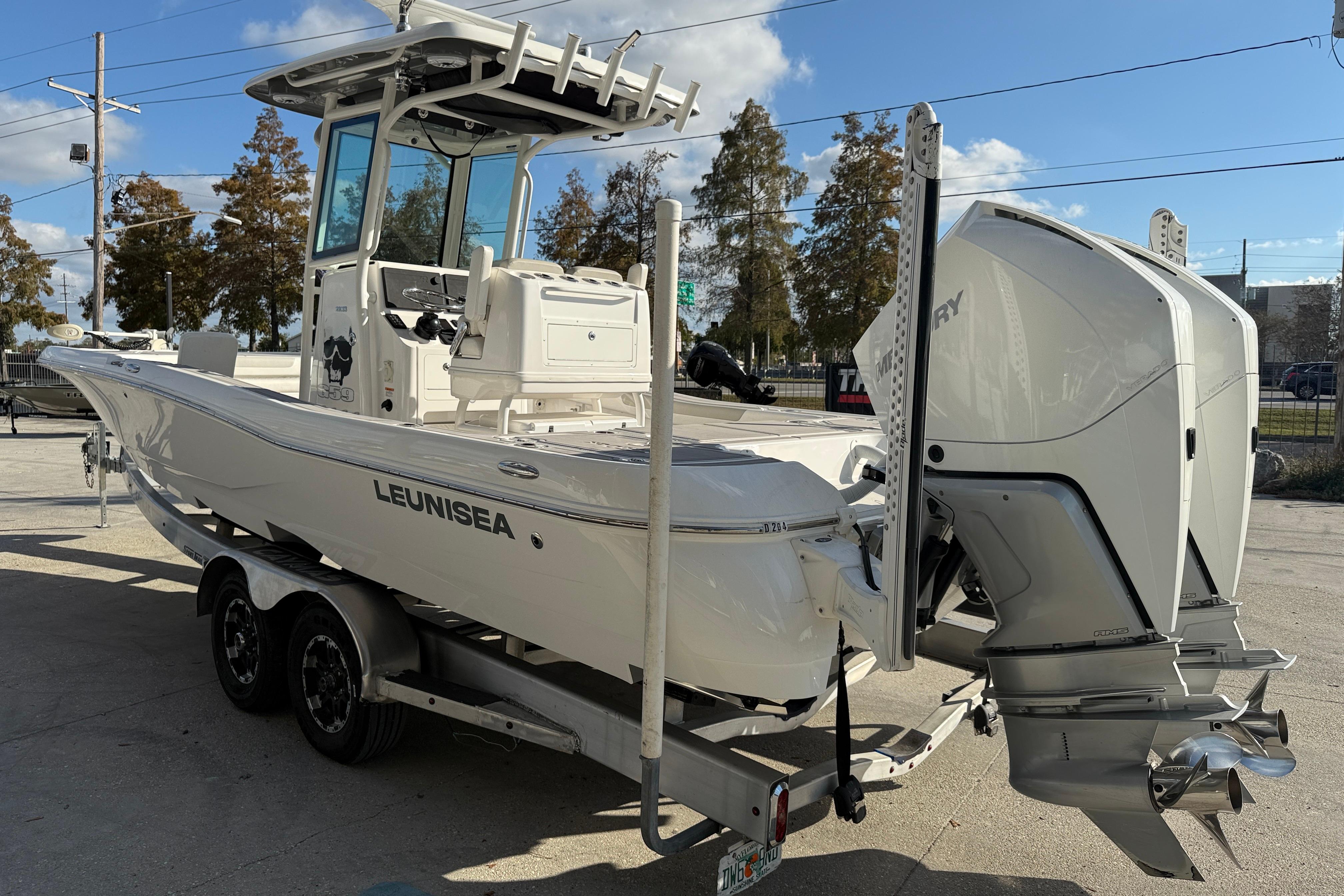 2022 Caymas 28 HB Twin boat on trailer, featuring dual Mercury engines.