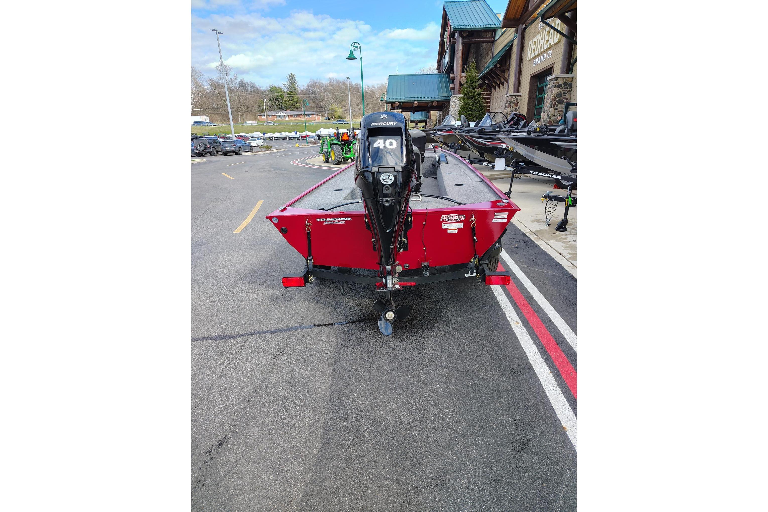 2025 Tracker Panfish 17 boat with Mercury 40 engine, parked outdoors.