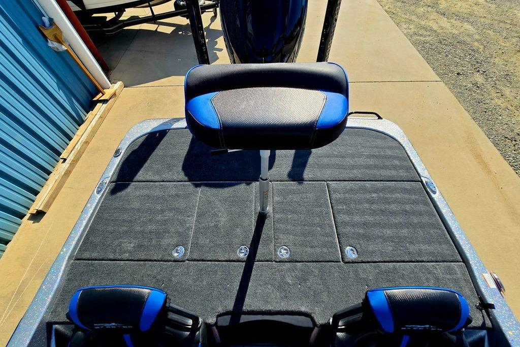 2026 Skeeter ZXE20 boat deck with blue and black seating, outdoor setting.